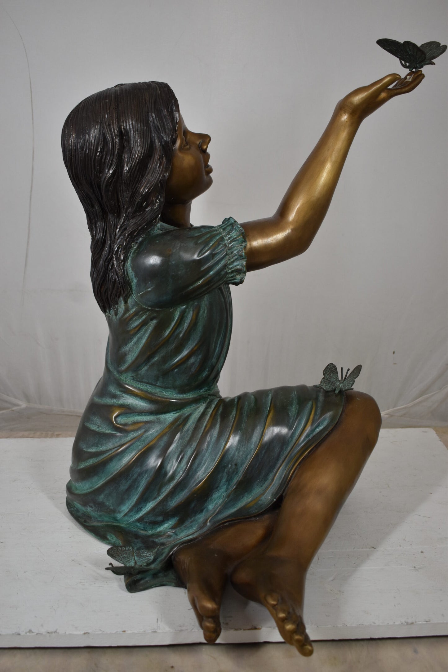 Girl with butterflies, green shirt Bronze Statue Size: 27" x 17" x 24"H