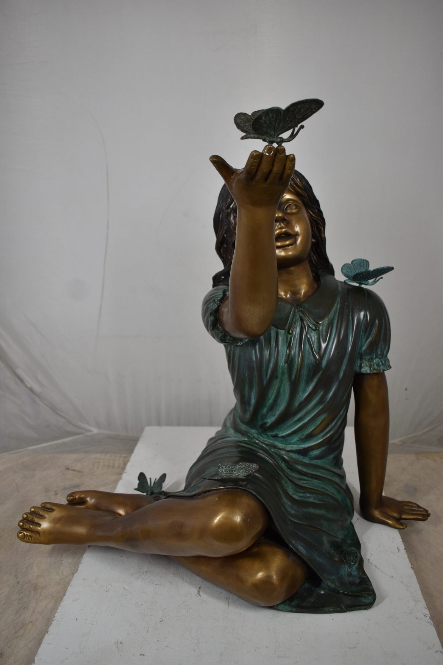Girl with butterflies, green shirt Bronze Statue Size: 27" x 17" x 24"H