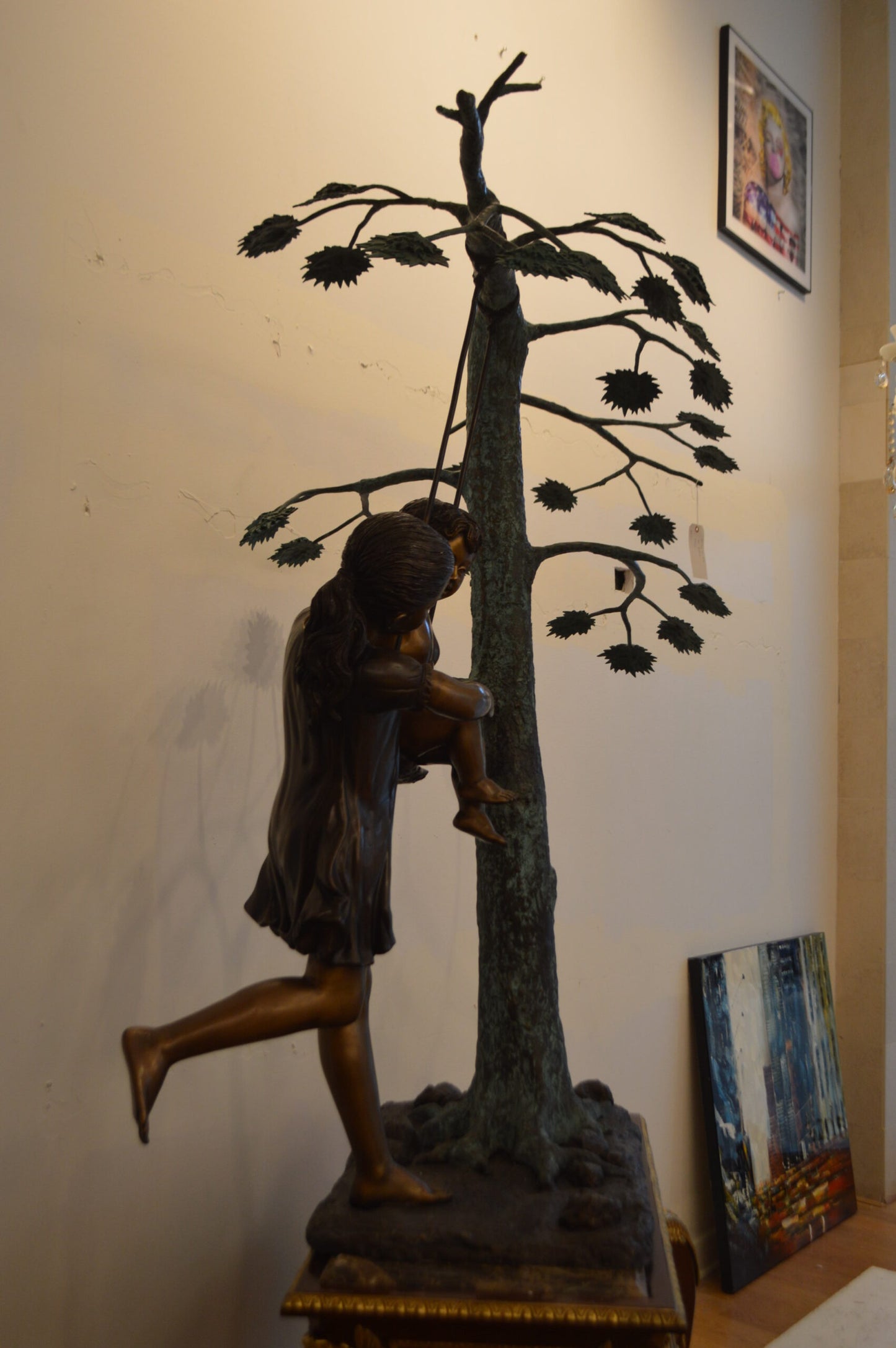 Swing Set Under A Three Bronze Statue - Size: 60"L x 33"W x 60"H.