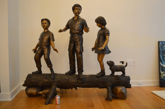 Three Kids With A Dog On A Log Bronze Statue - Size: 78"L x 26"W x 62"H.