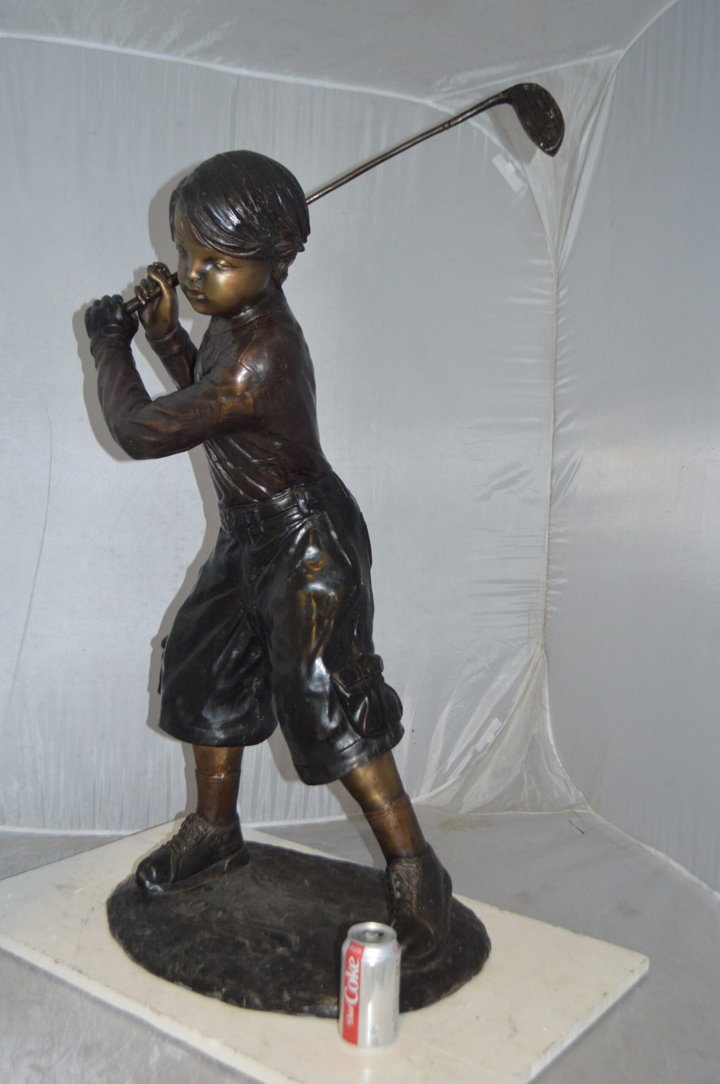 Young Boy Plays Golf Bronze Statue -  Size: 19"L x 21"W x 45"H.