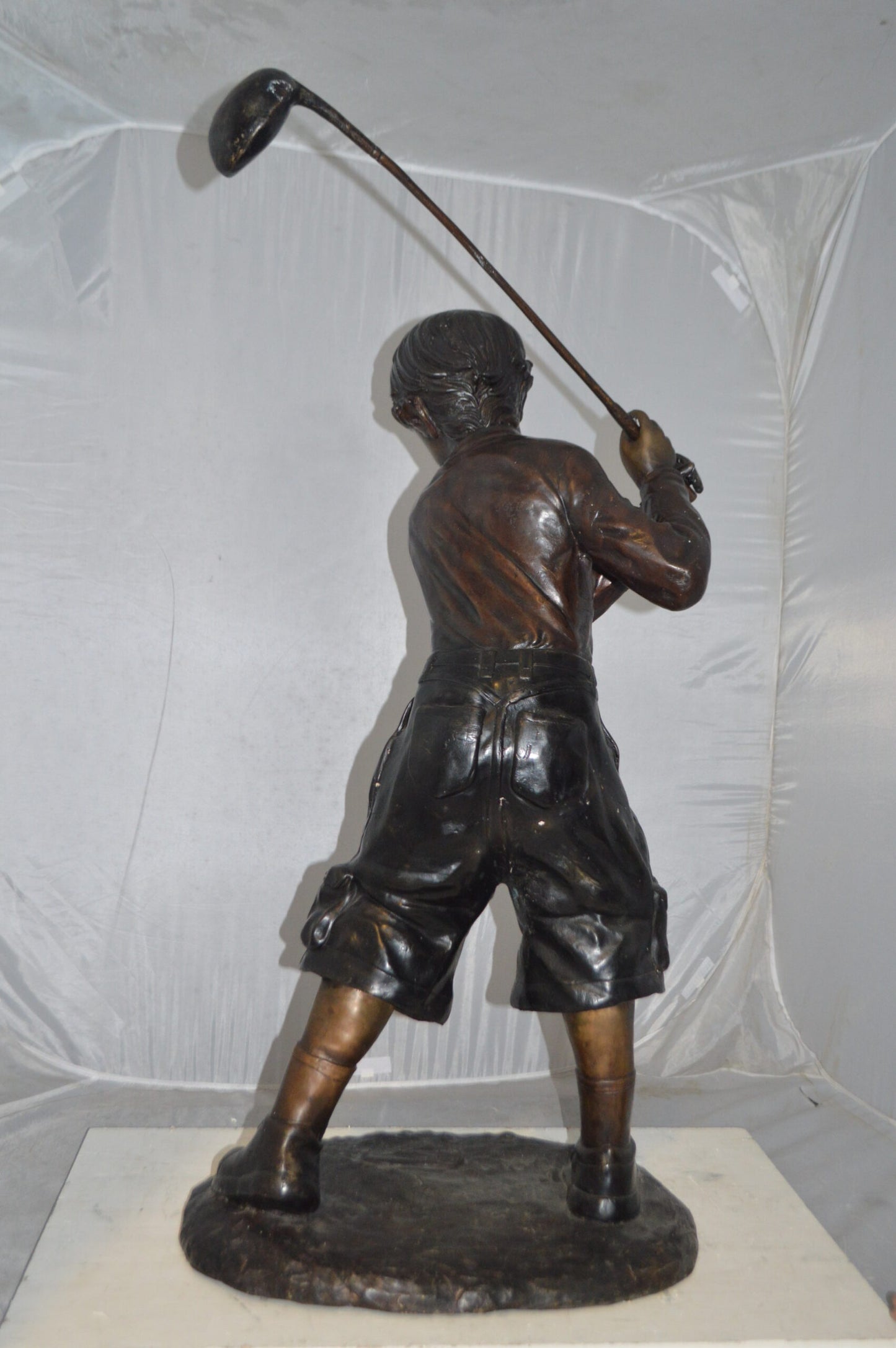 Young Boy Plays Golf Bronze Statue -  Size: 19"L x 21"W x 45"H.