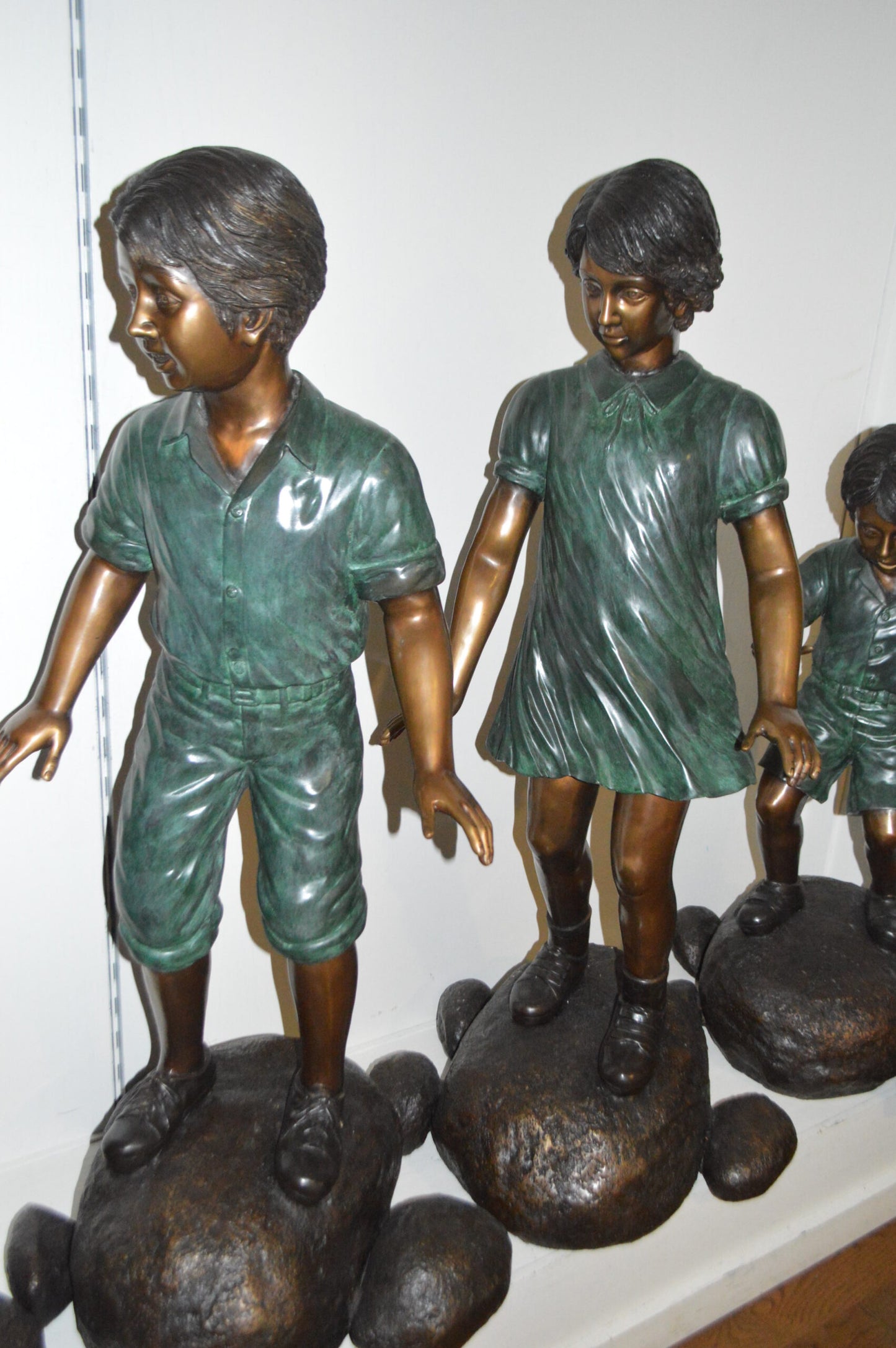 Five Kids Walking on Rocks Bronze Statues - Size: "L x "W x "H.