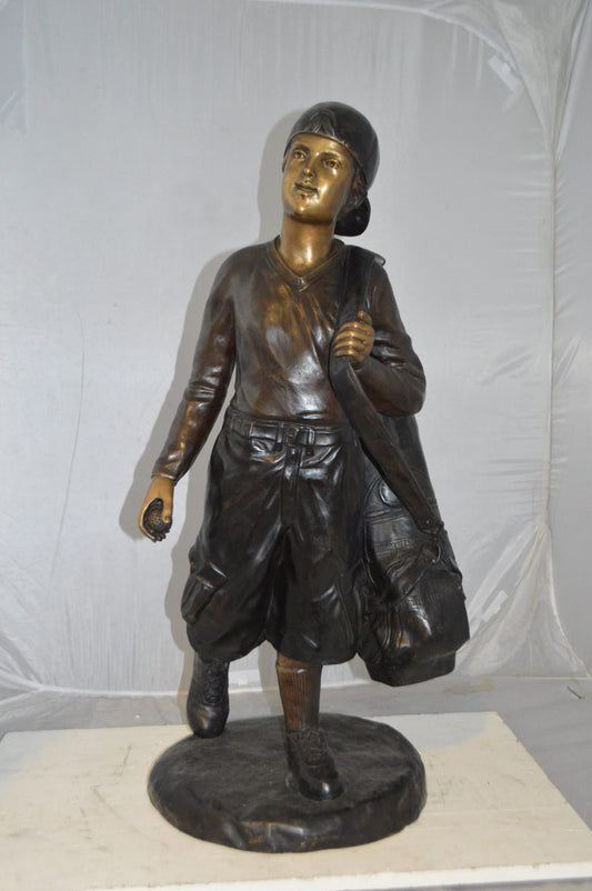 Boy Carrying A Golf Bag Bronze Statue -  Size: 15"L x 15"W x 38"H.