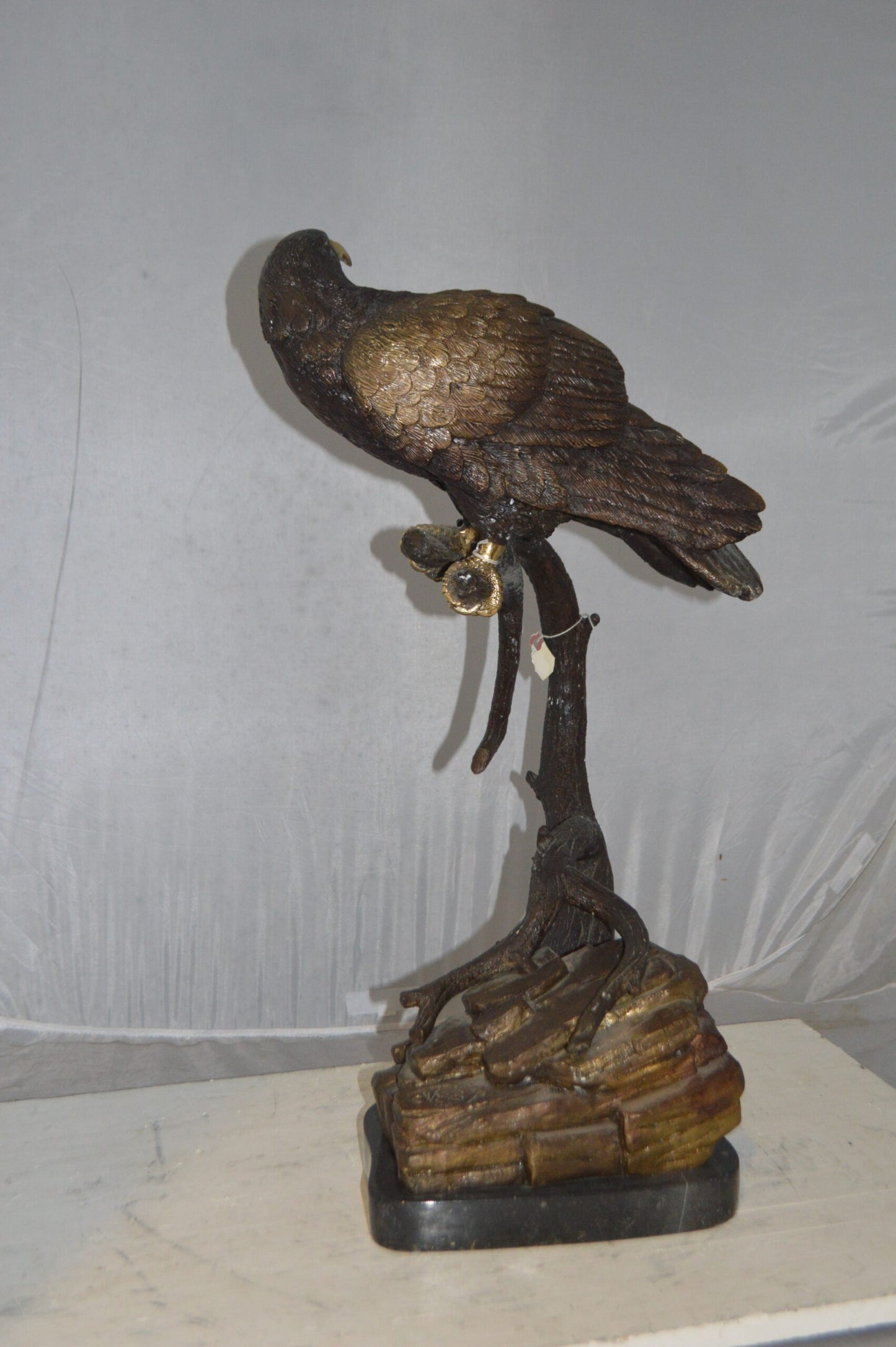 Falcon On a Branch Bronze Statue - Size: 15"L x 15"W x 28"H.