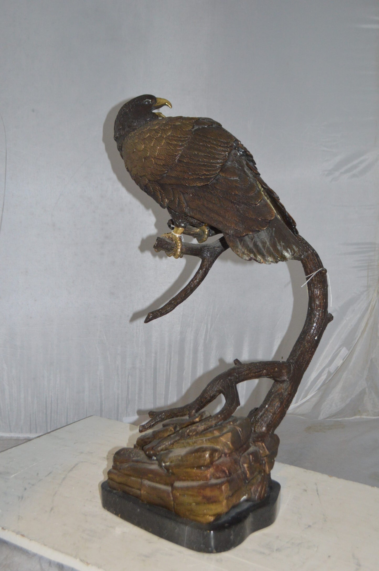Falcon On a Branch Bronze Statue - Size: 15"L x 15"W x 28"H.