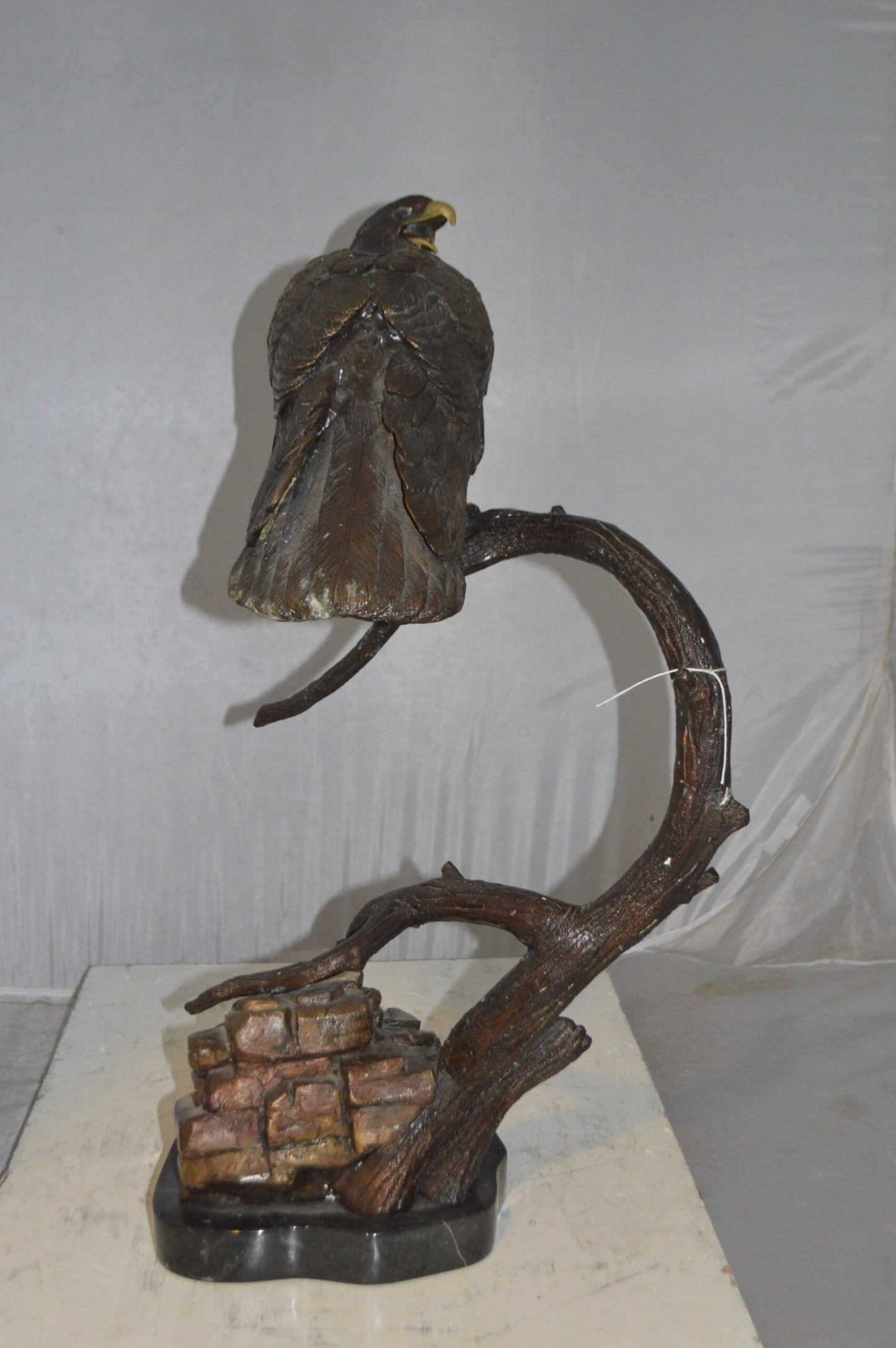 Falcon On a Branch Bronze Statue - Size: 15"L x 15"W x 28"H.