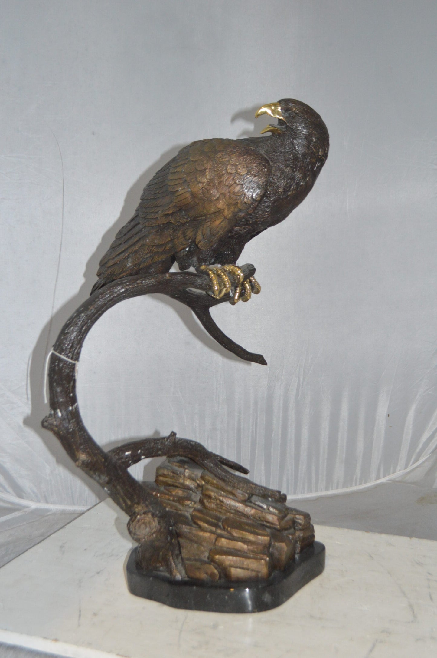Falcon On a Branch Bronze Statue - Size: 15"L x 15"W x 28"H.
