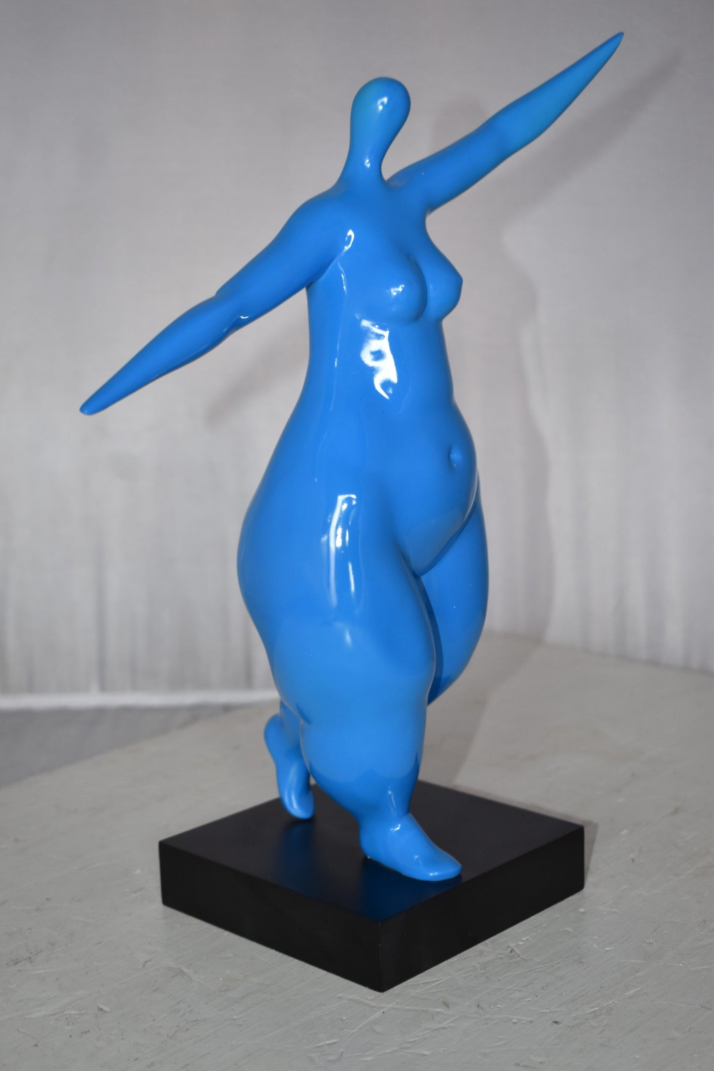 Modern Art Voluptuous Blue Lady Hand Up Resin Statue Size: 14" x 5" x 16"H