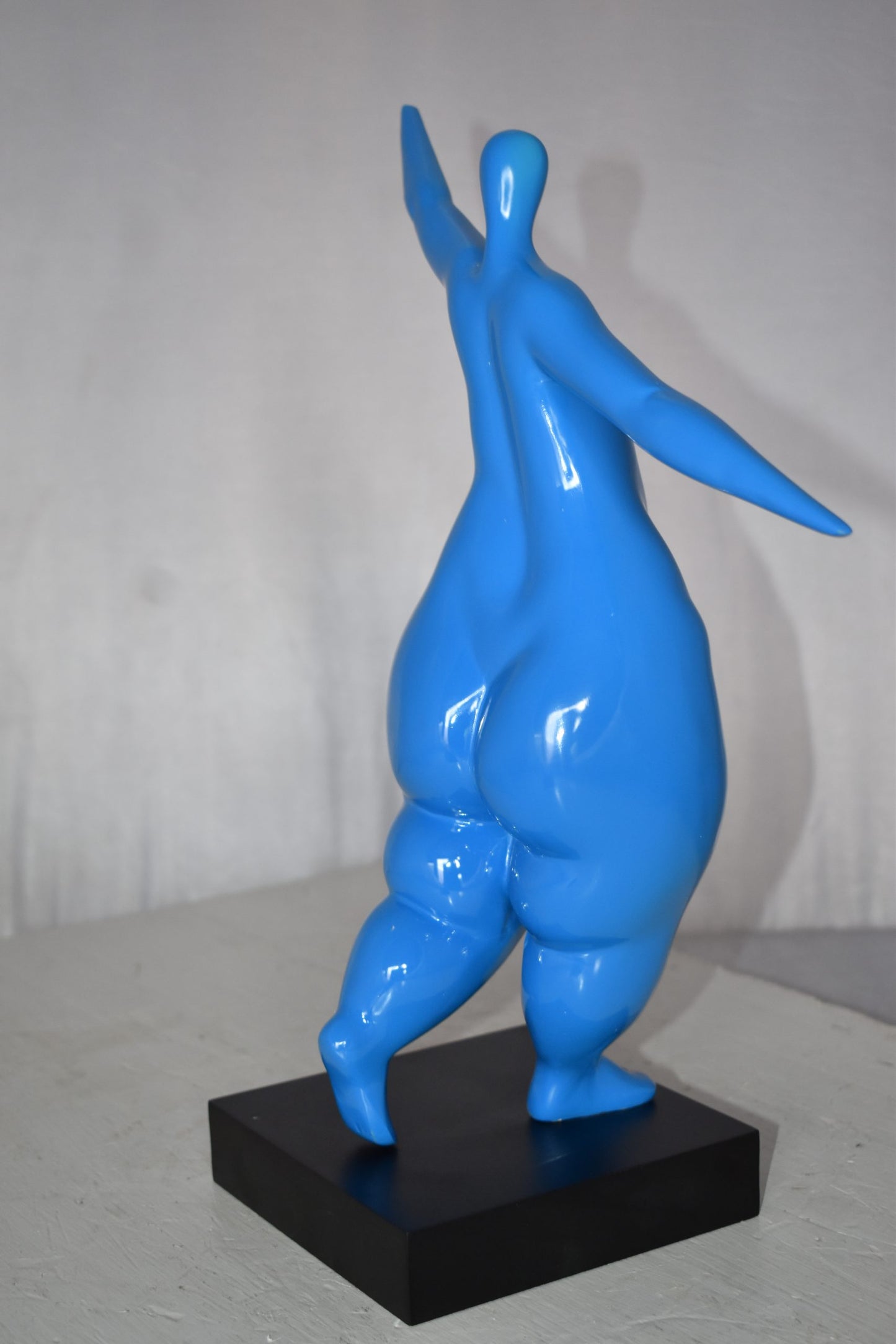 Modern Art Voluptuous Blue Lady Hand Up Resin Statue Size: 14" x 5" x 16"H