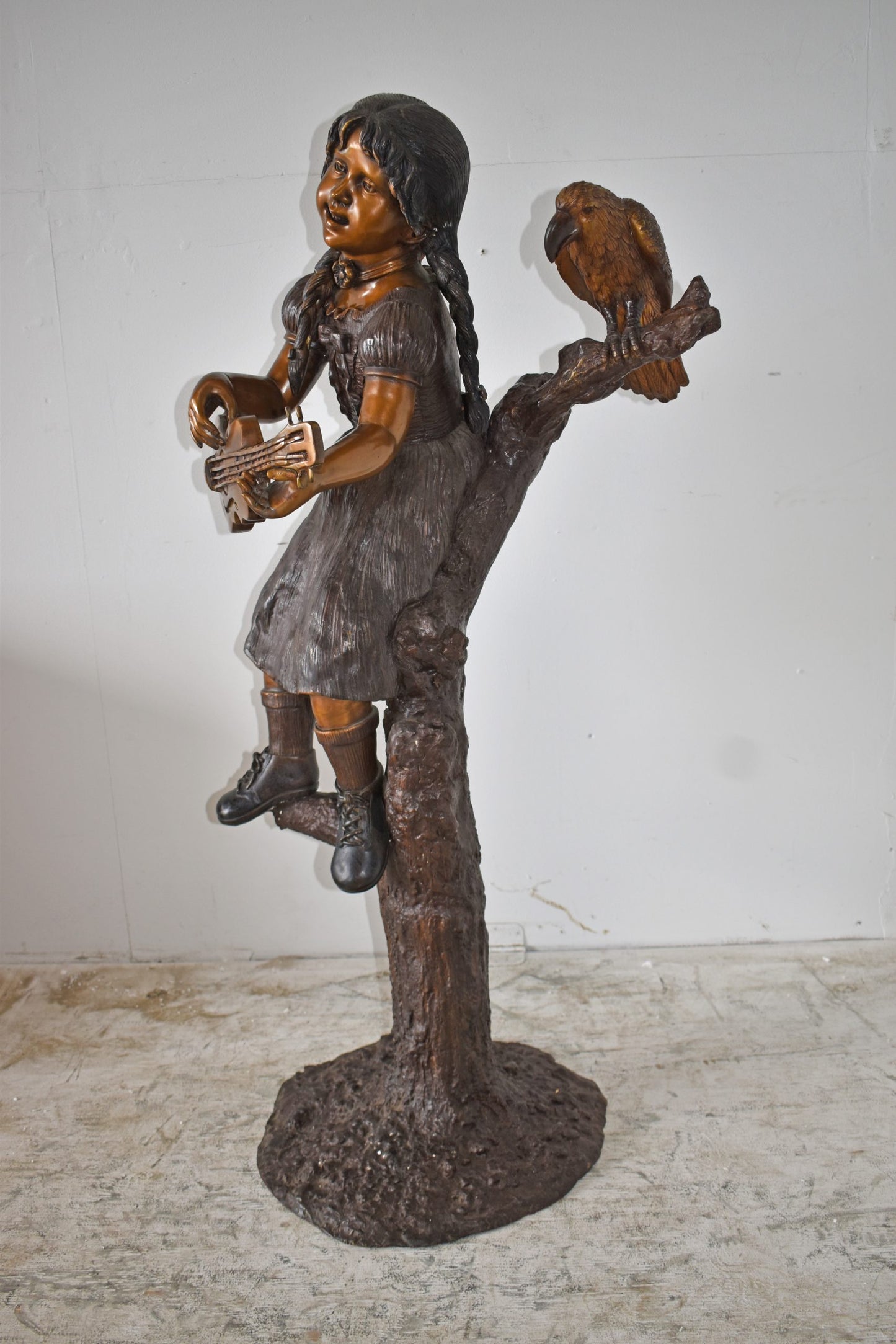Girl on a Tree Playing the Ukulele with a Parrot Bronze Statue 25" x 23" x 50"H