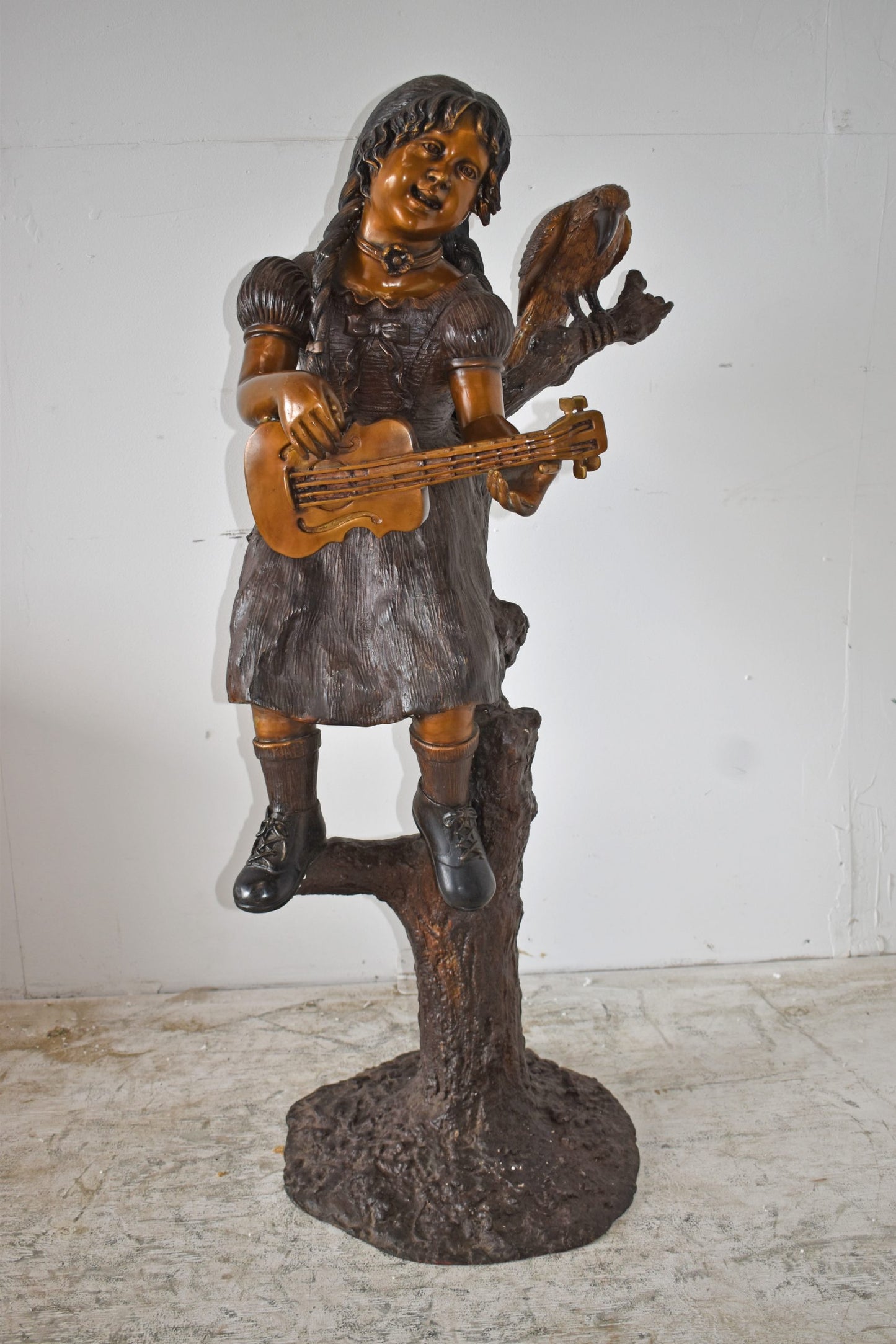 Girl on a Tree Playing the Ukulele with a Parrot Bronze Statue 25" x 23" x 50"H
