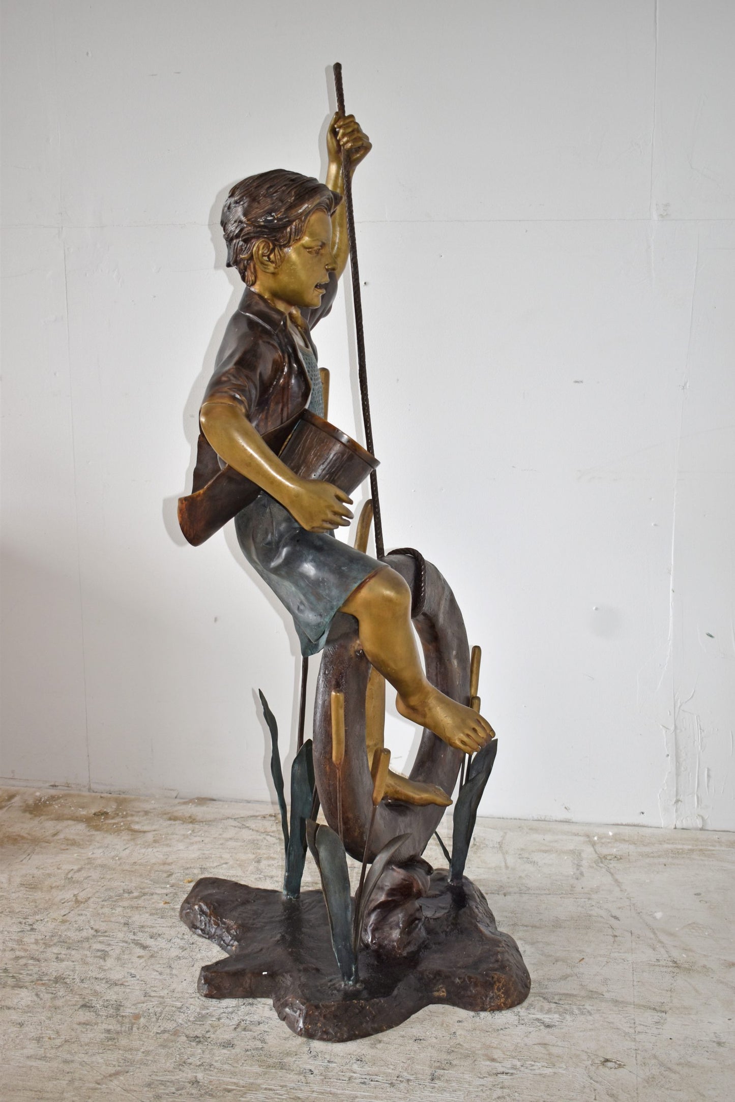 Pirate Sitting on a Life Saver Wheel Bronze Statue Size: 24" x 28" x 57"H