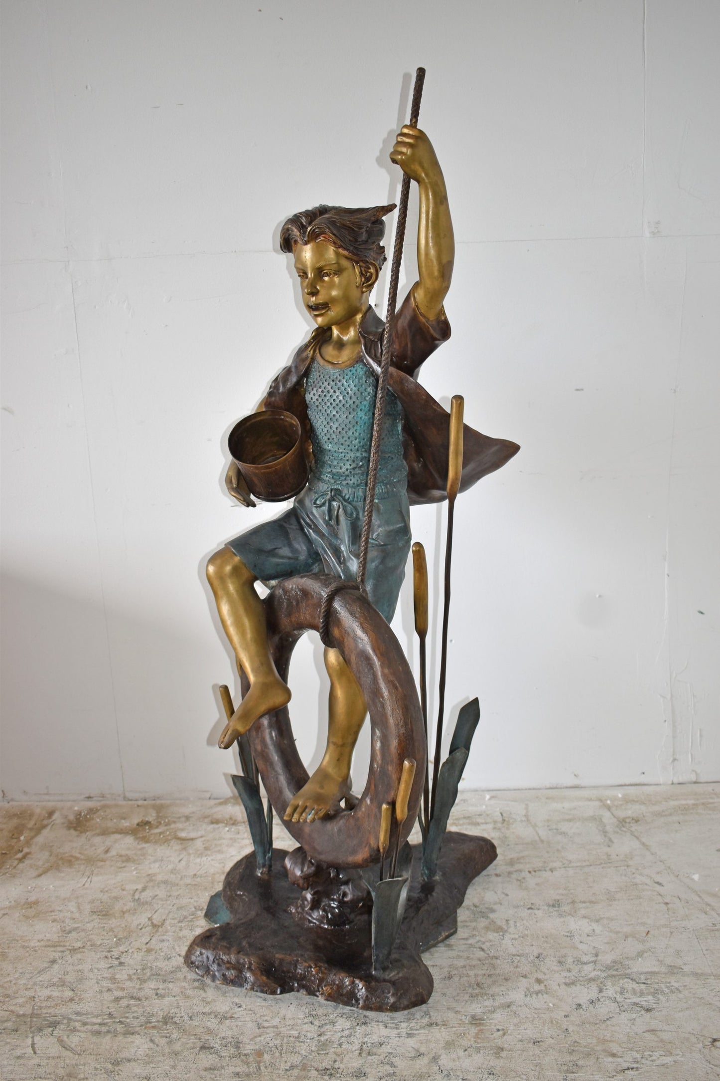 Pirate Sitting on a Life Saver Wheel Bronze Statue Size: 24" x 28" x 57"H