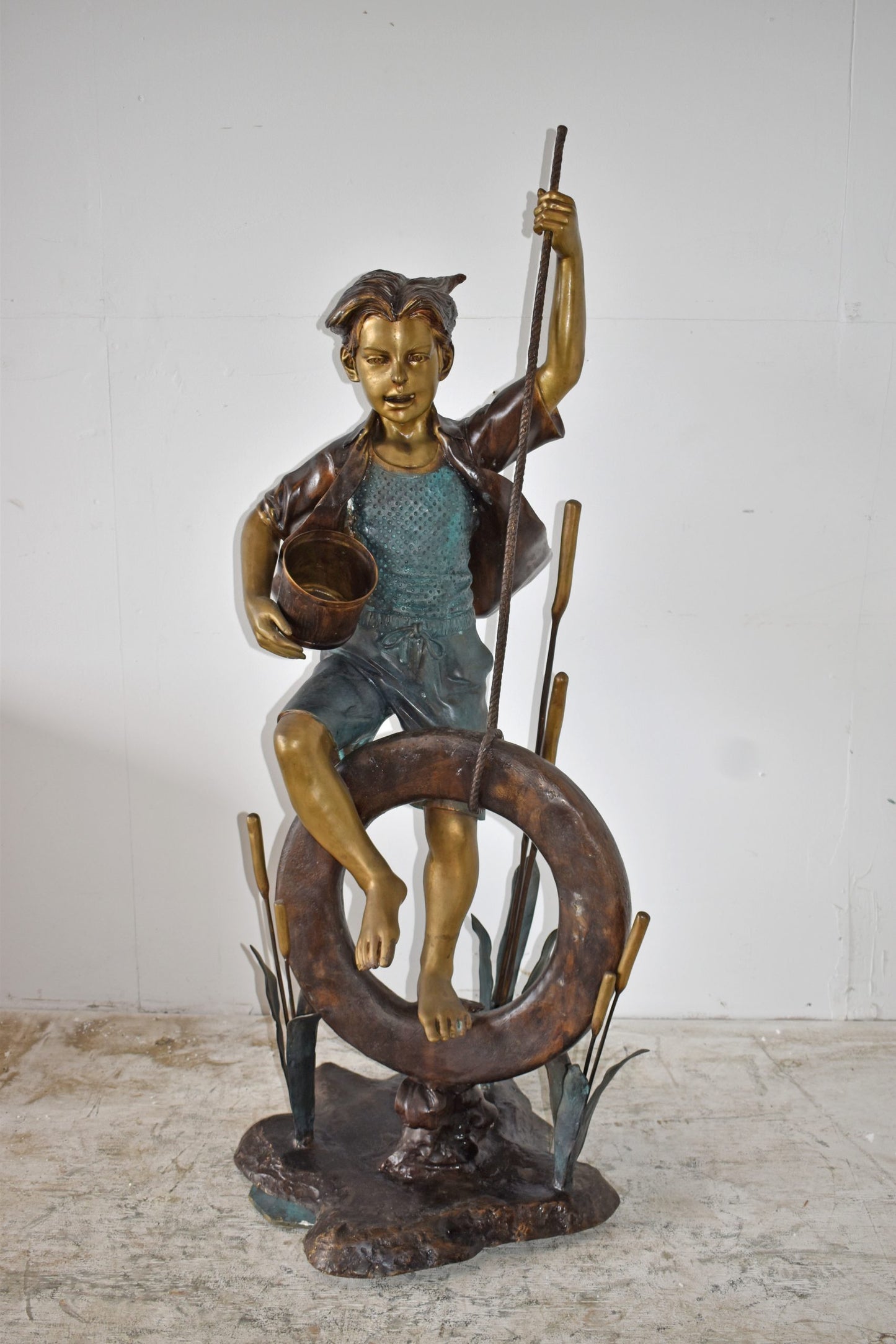 Pirate Sitting on a Life Saver Wheel Bronze Statue Size: 24" x 28" x 57"H