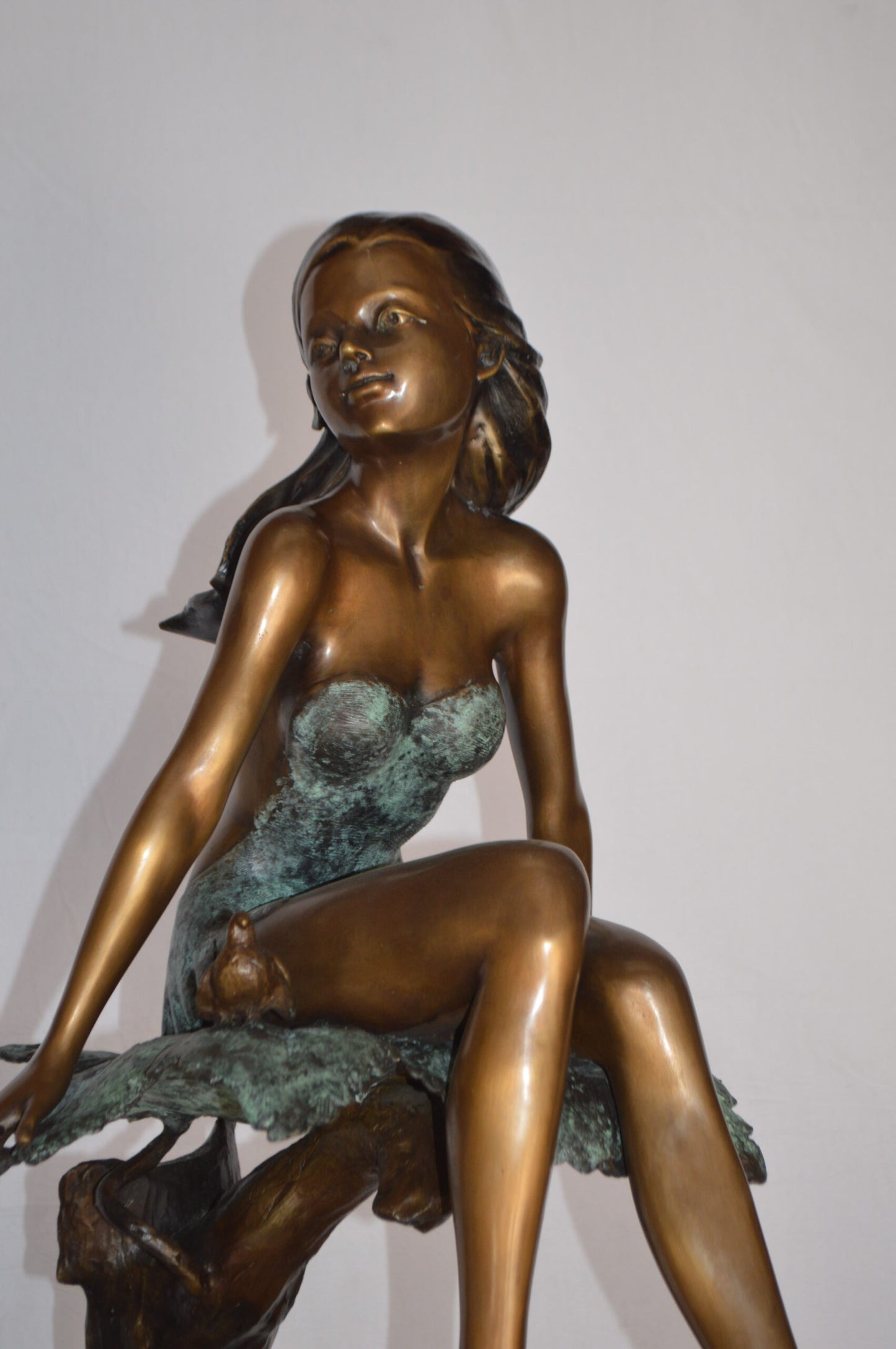 Girl on Maple Leaf Bronze Statue - Size: 23"L x 18"W x 44"H.