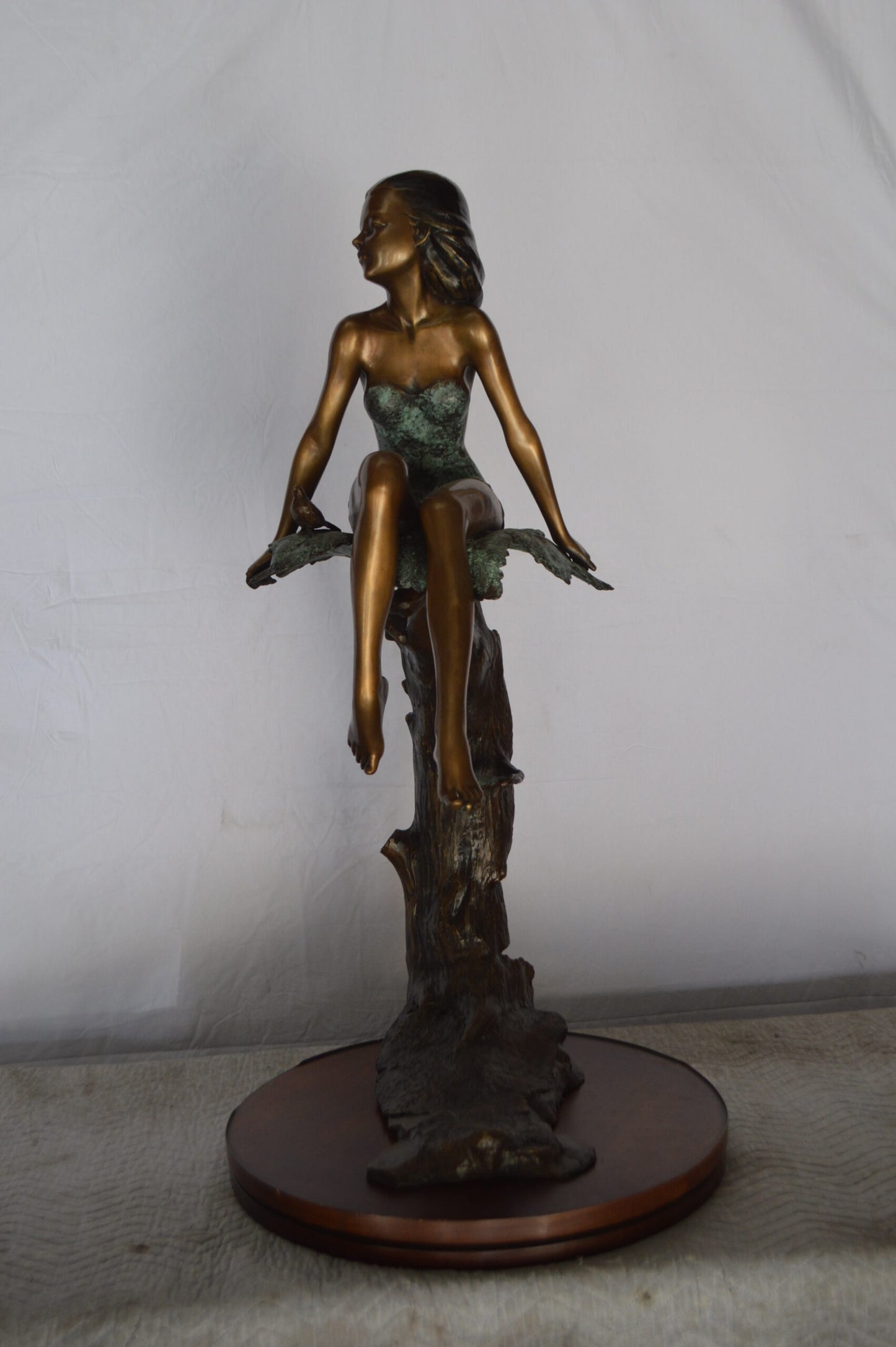 Girl on Maple Leaf Bronze Statue - Size: 23"L x 18"W x 44"H.