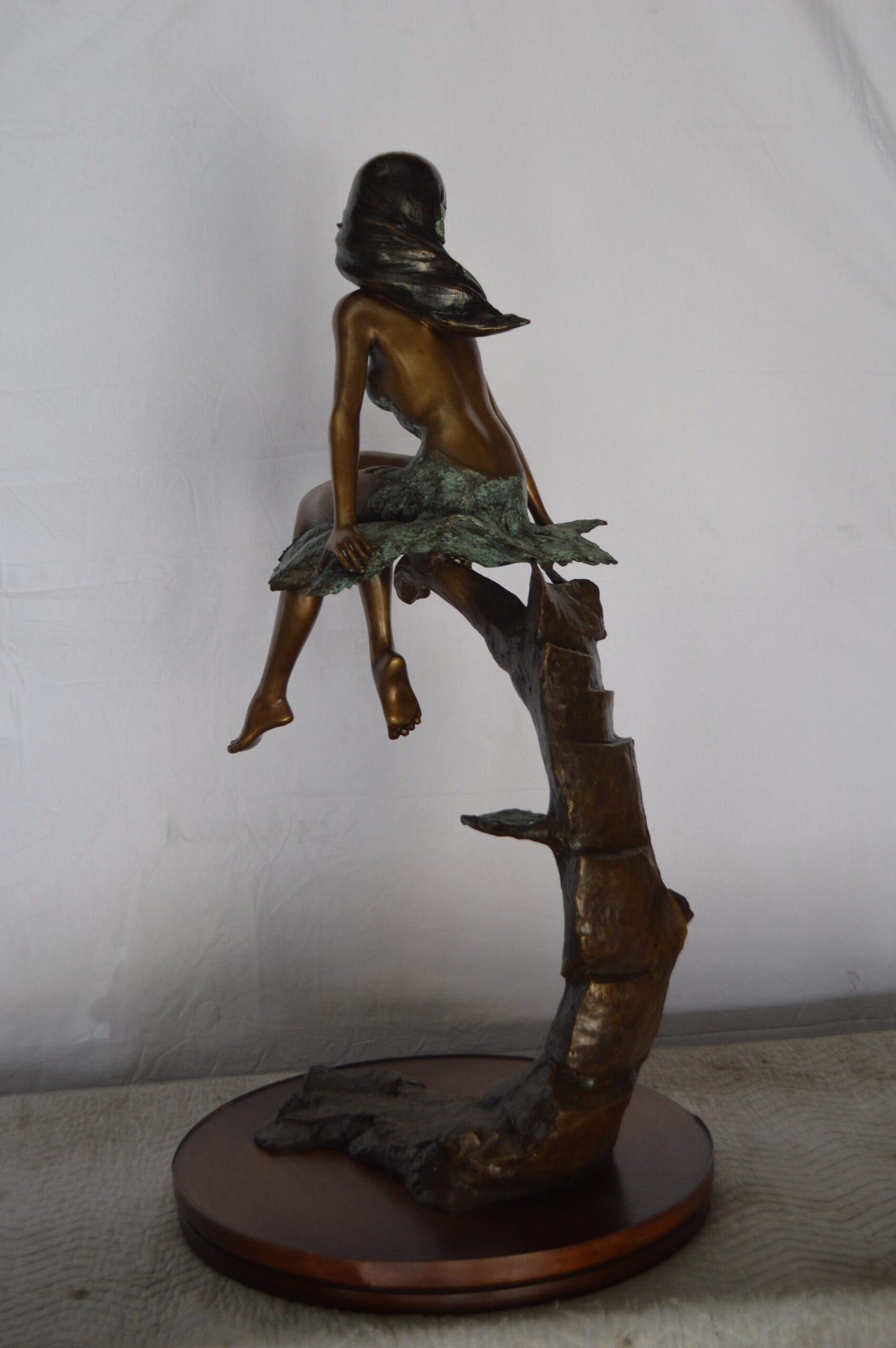 Girl on Maple Leaf Bronze Statue - Size: 23"L x 18"W x 44"H.