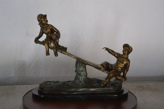 Boys Playing Seesaw on a Marble Base Bronze Statue -  Size: 22"L x 8"W x 17"H.