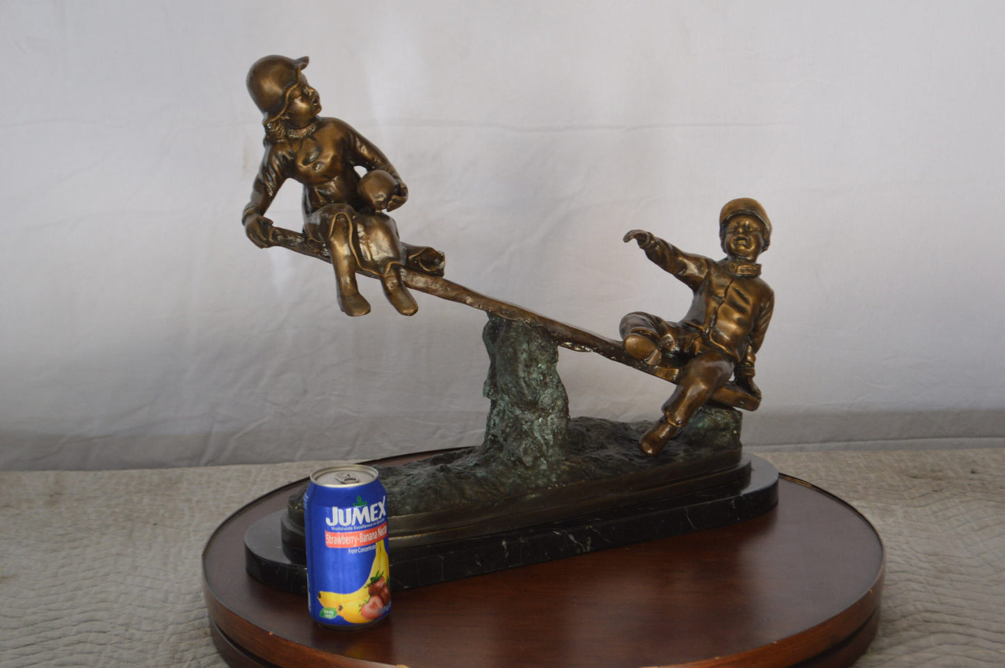 Boys Playing Seesaw on a Marble Base Bronze Statue - Size: 22"L x 8"W x 17"H.