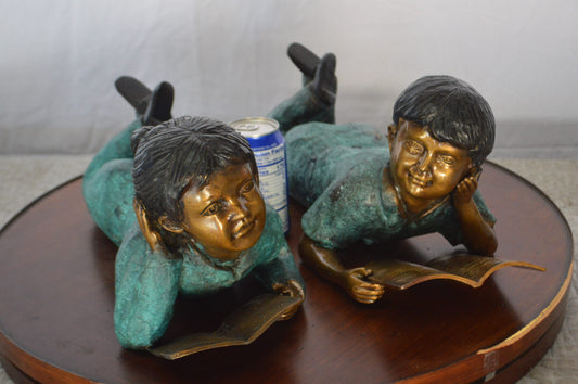 Set of a Boy and a Girl Reading a Book Bronze Statue - Size: 16"L x 7"W x 8"H.