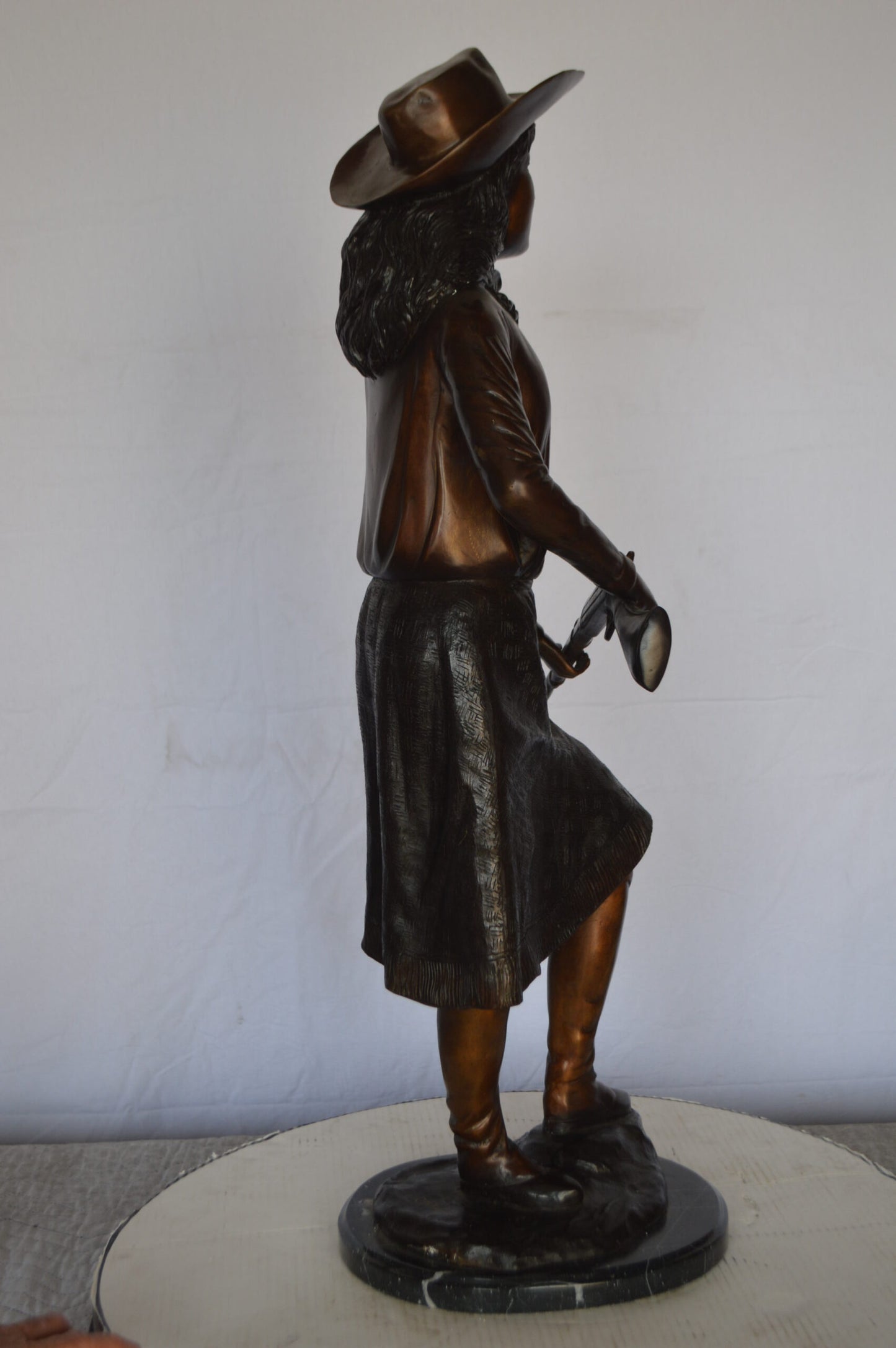 Annie Oakley Bronze Statue Mounted on a Marble Base -  Size: 11"L x 9"W x 33"H.