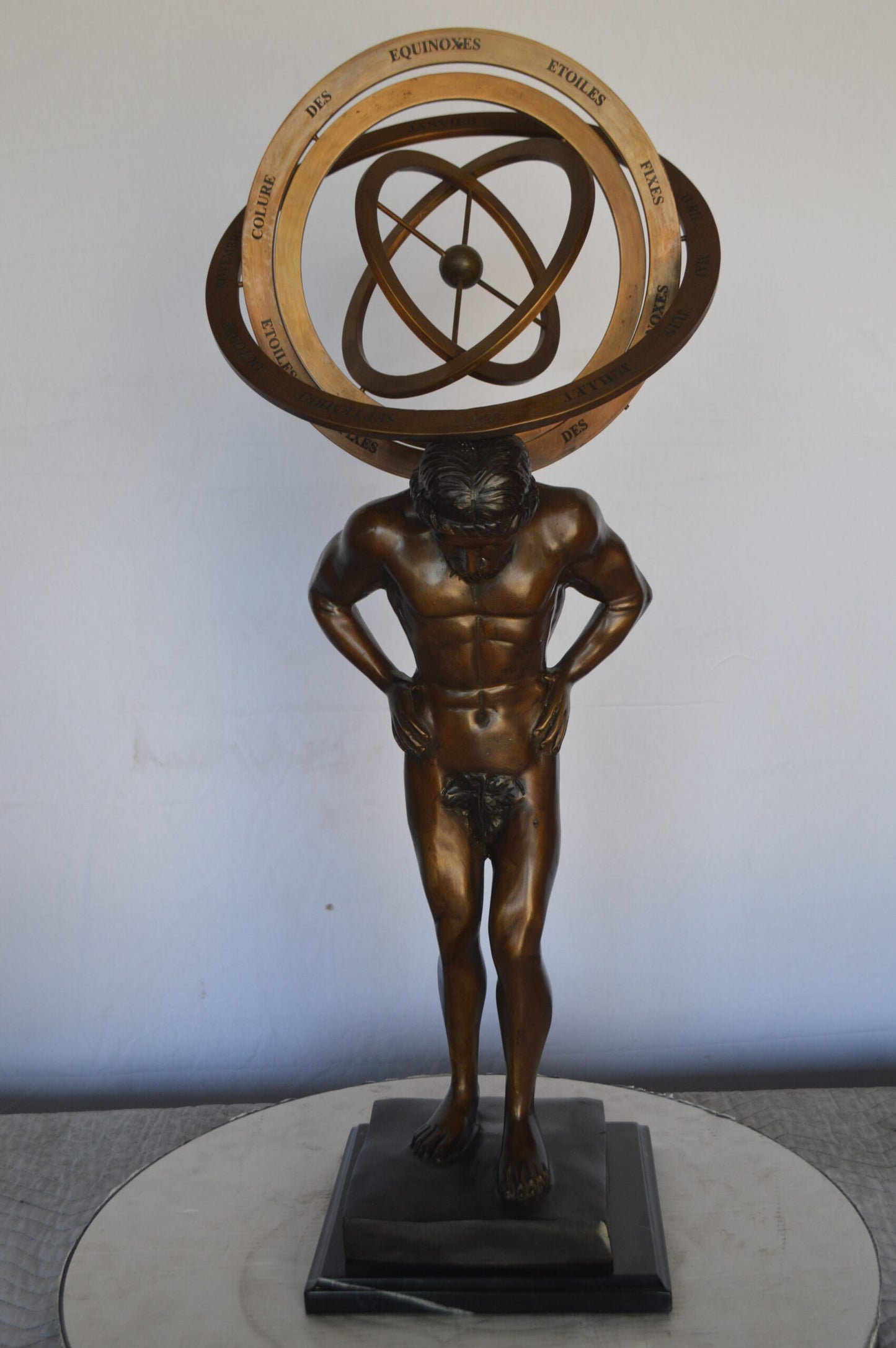 Man with Sundial on his Back Bronze Statue - Size: 14"L x 12"W x 35"H.