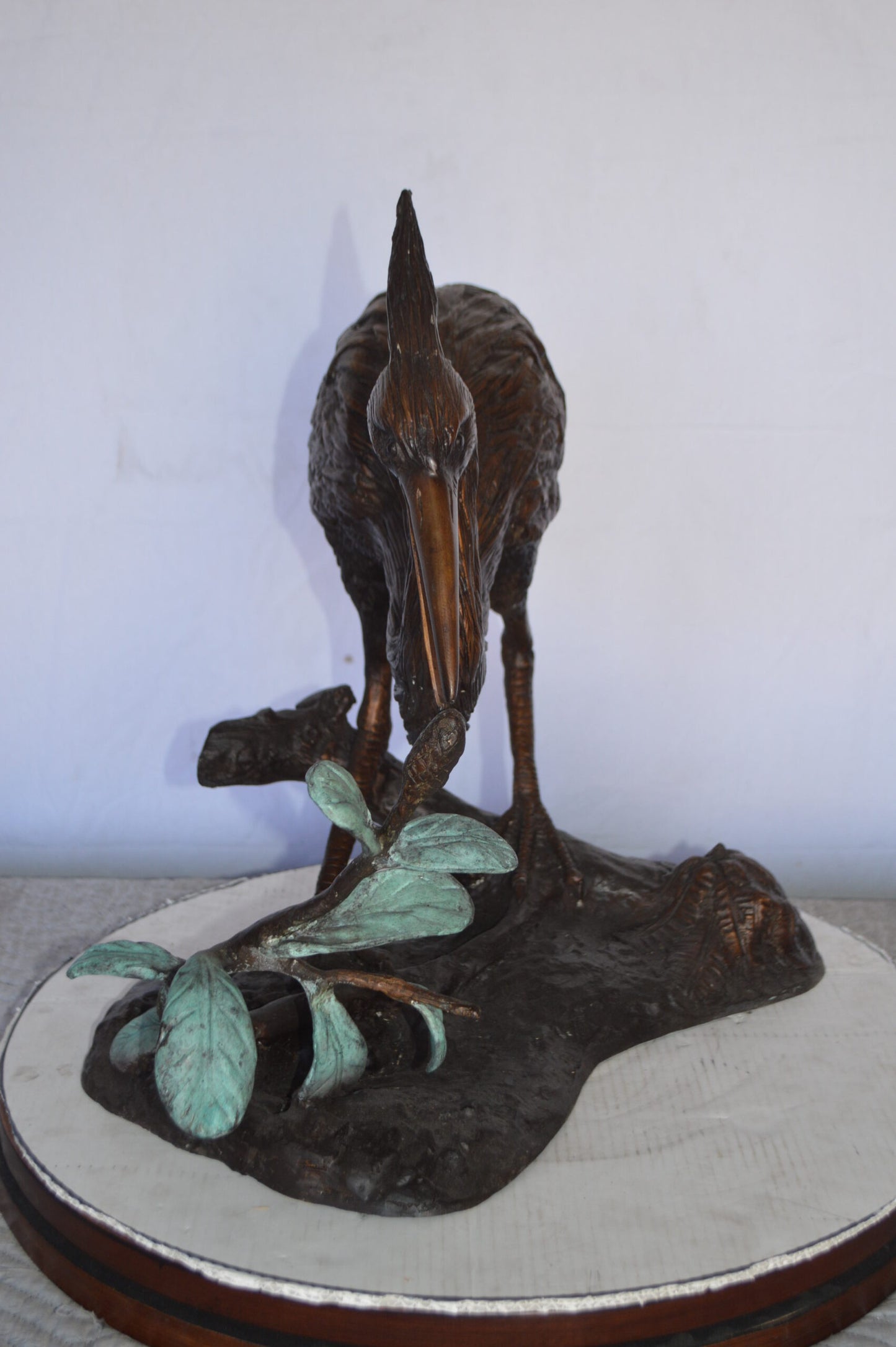 Crane on a Tree Bronze Statue -  Size: 24"L x 20"W x 21"H.
