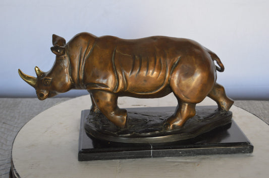 Rhino Bronze Statue Mounted on a Marble Base - Size: 21"L x 9"W x 10"H.