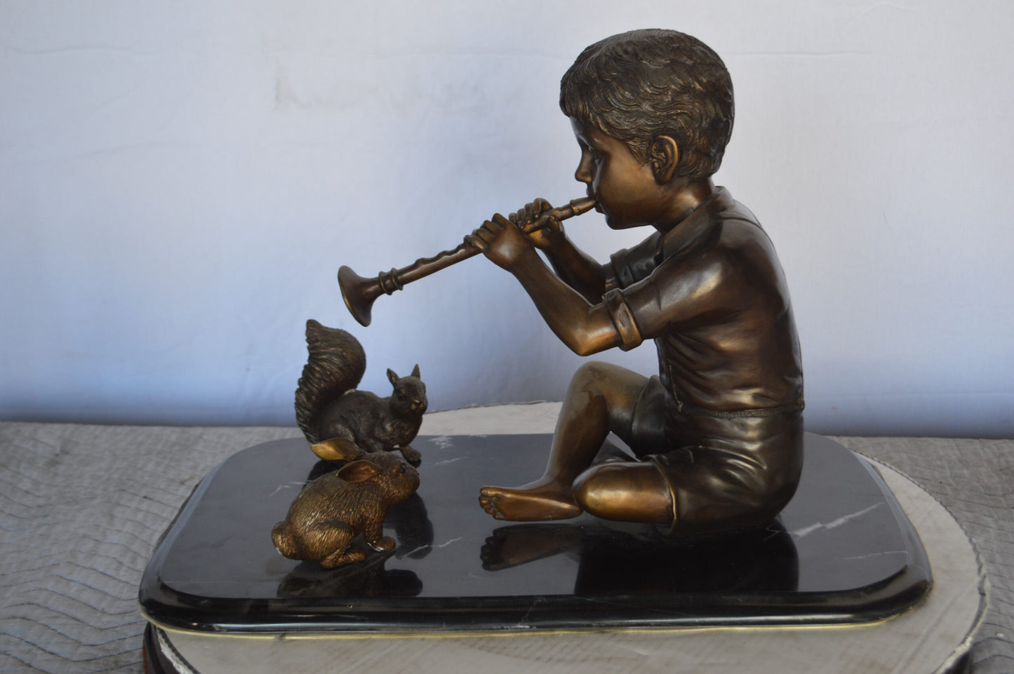 Boy With Rabbit And Squirrel Bronze Statue - Size: 22"L x 13"W x 16"H.