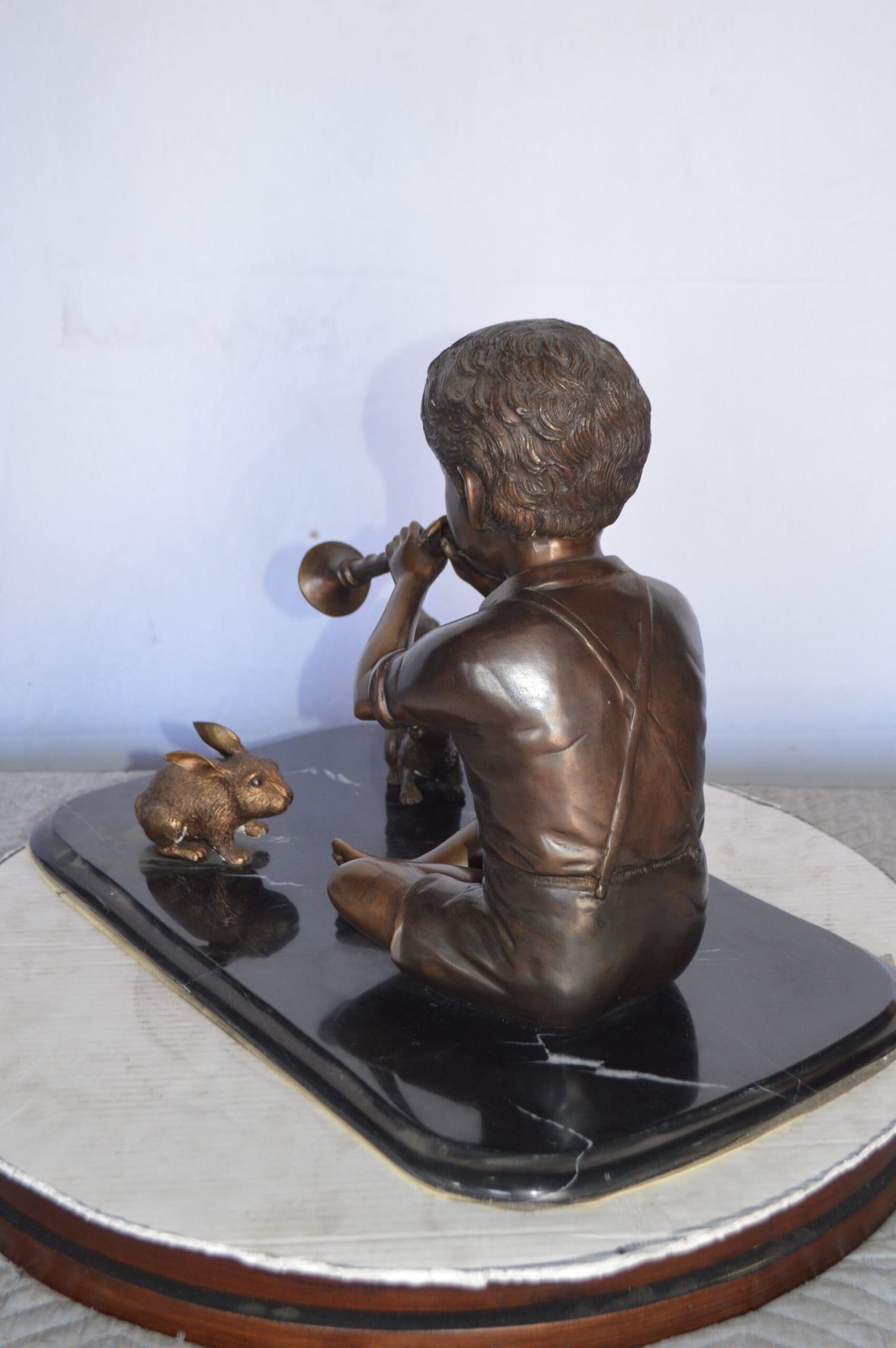 Boy With Rabbit And Squirrel Bronze Statue - Size: 22"L x 13"W x 16"H.