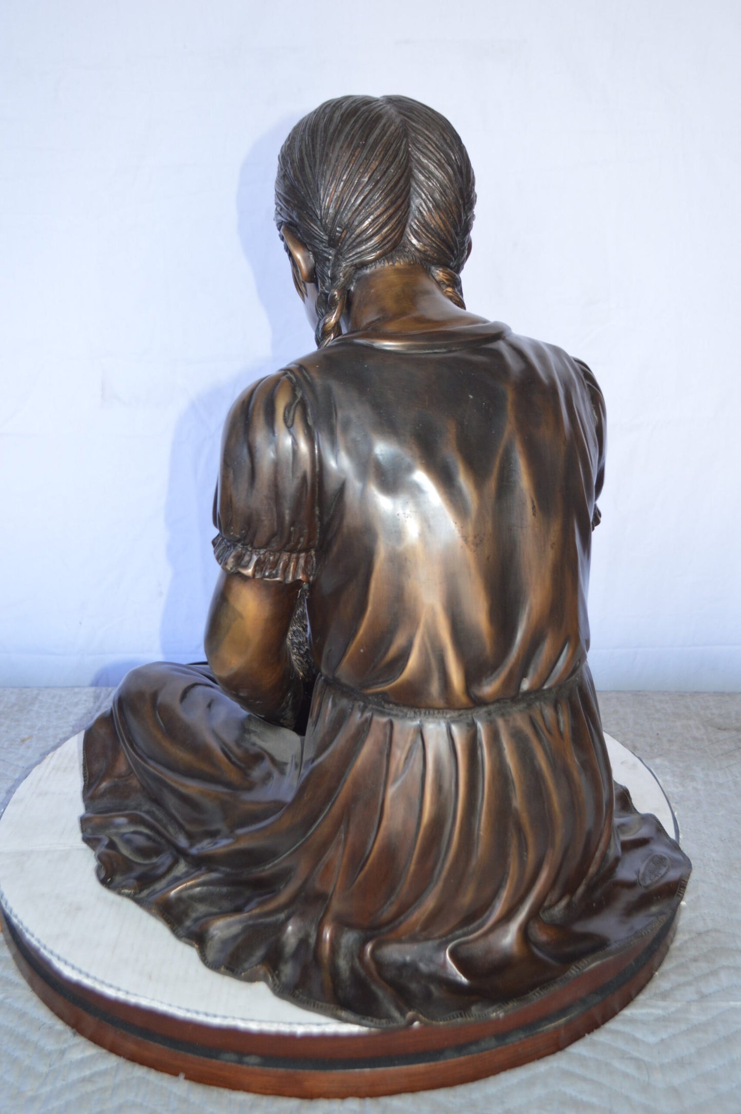 Sandra Sitting With Her Rabbit Bronze Statue - Size: 25"L x 18"W x 25"H.