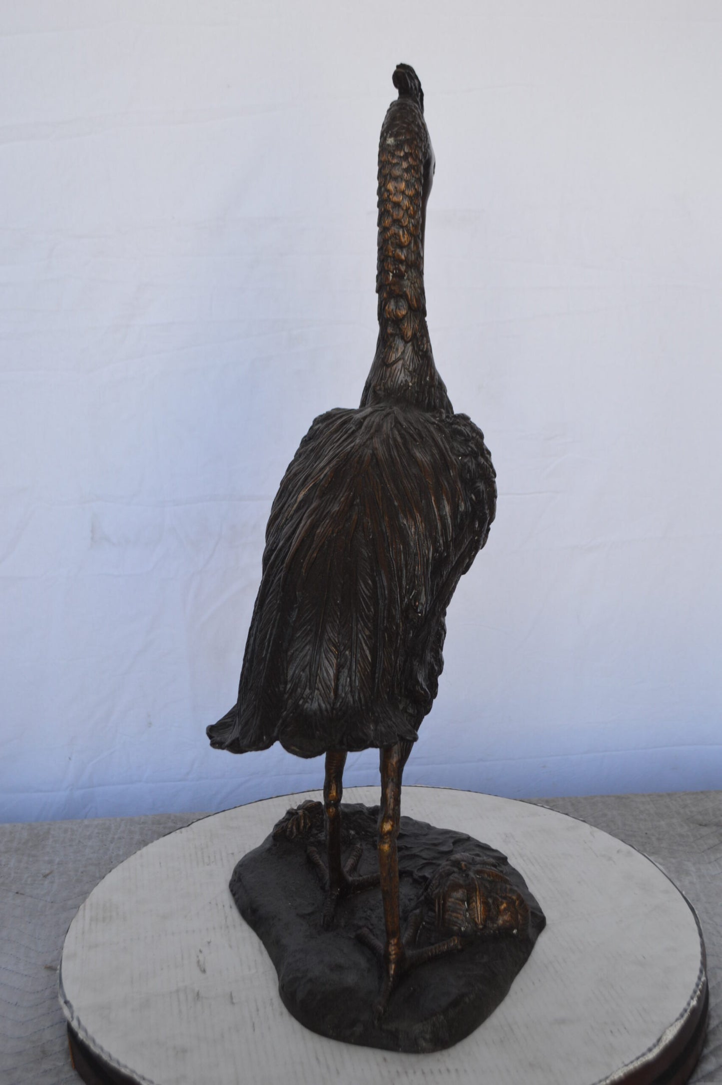 Crane Looking Down Bronze Statue - Size: 17"L x 12"W x 31"H.