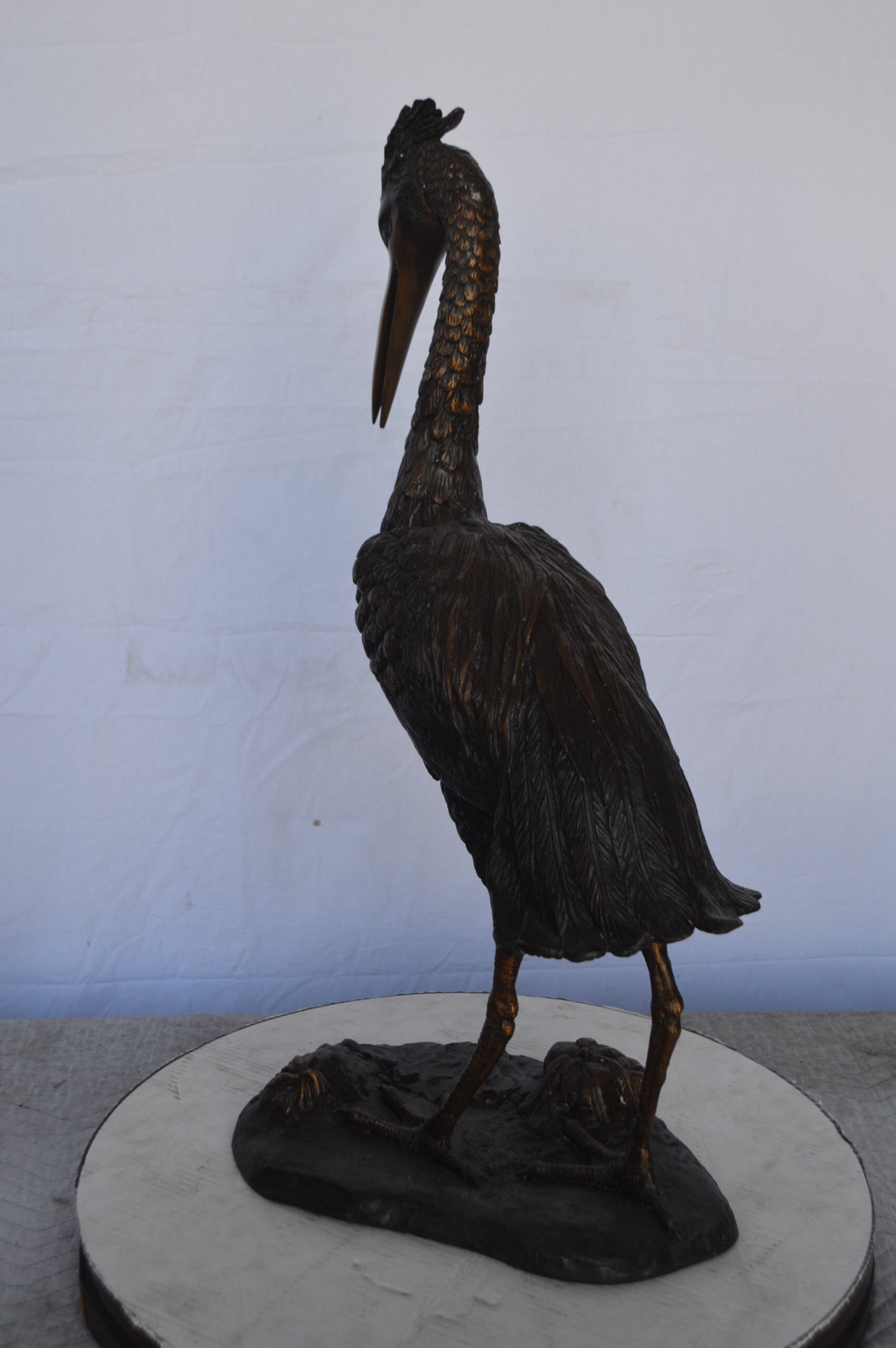 Crane Looking Down Bronze Statue - Size: 17"L x 12"W x 31"H.