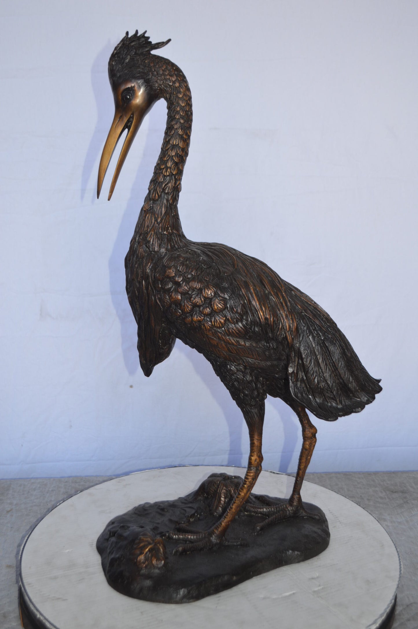 Crane Looking Down Bronze Statue - Size: 17"L x 12"W x 31"H.