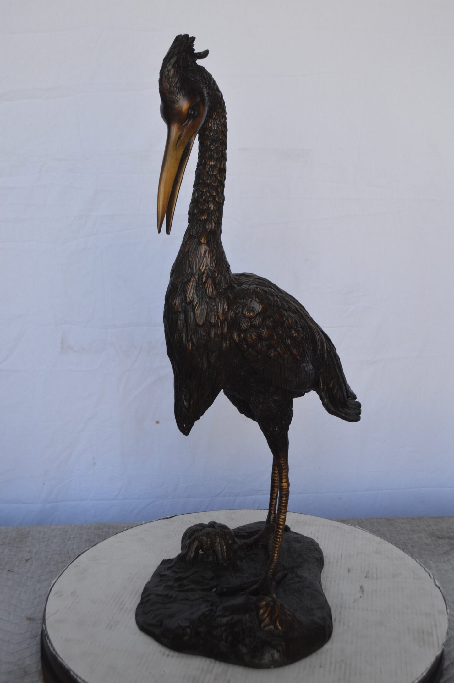 Crane Looking Down Bronze Statue -  Size: 17"L x 12"W x 31"H.