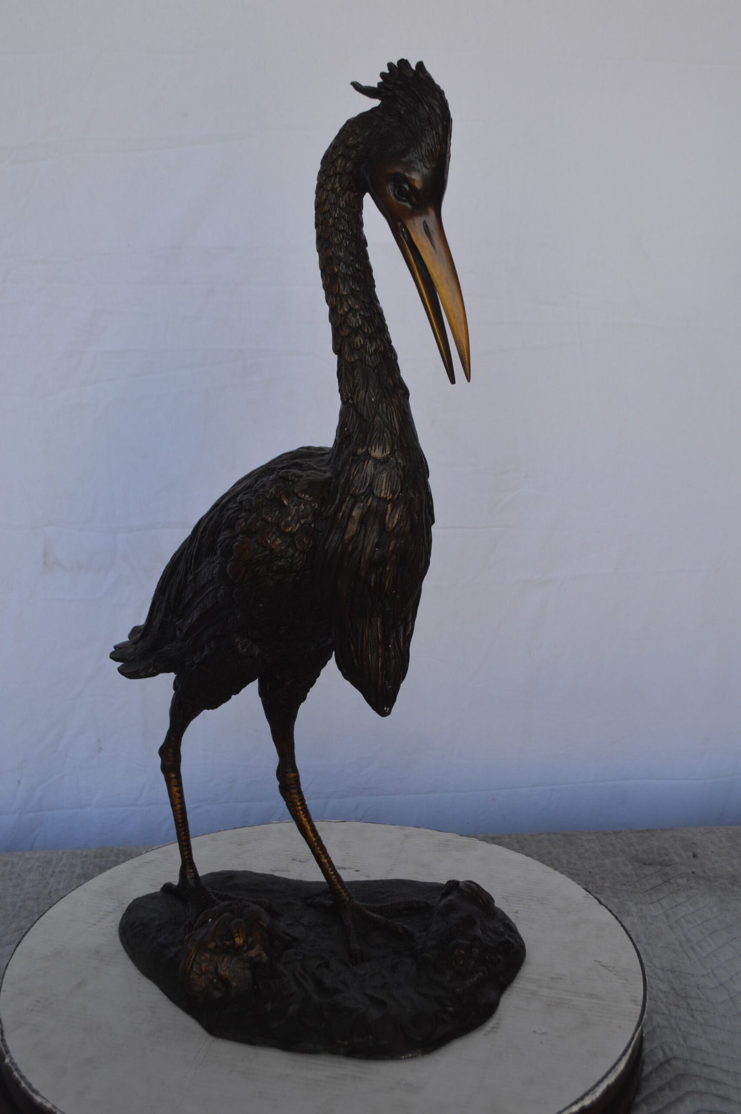 Crane Looking Down Bronze Statue - Size: 17"L x 12"W x 31"H.