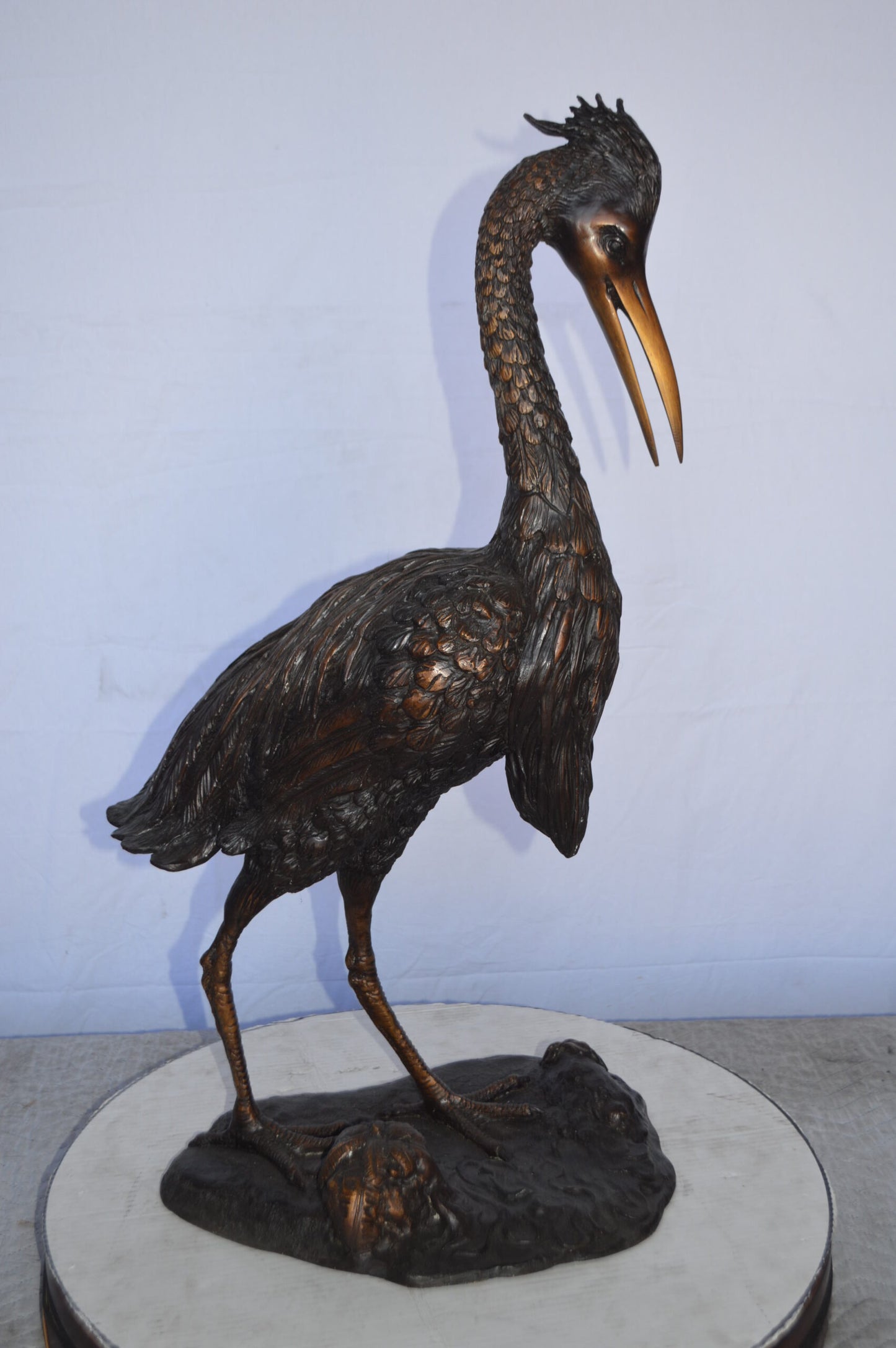 Crane Looking Down Bronze Statue - Size: 17"L x 12"W x 31"H.