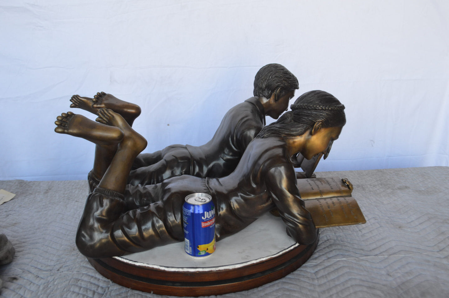 A Set of Boy and Girl Reading Books Bronze Statue - Size: 31"L x 10"W x 14"H.