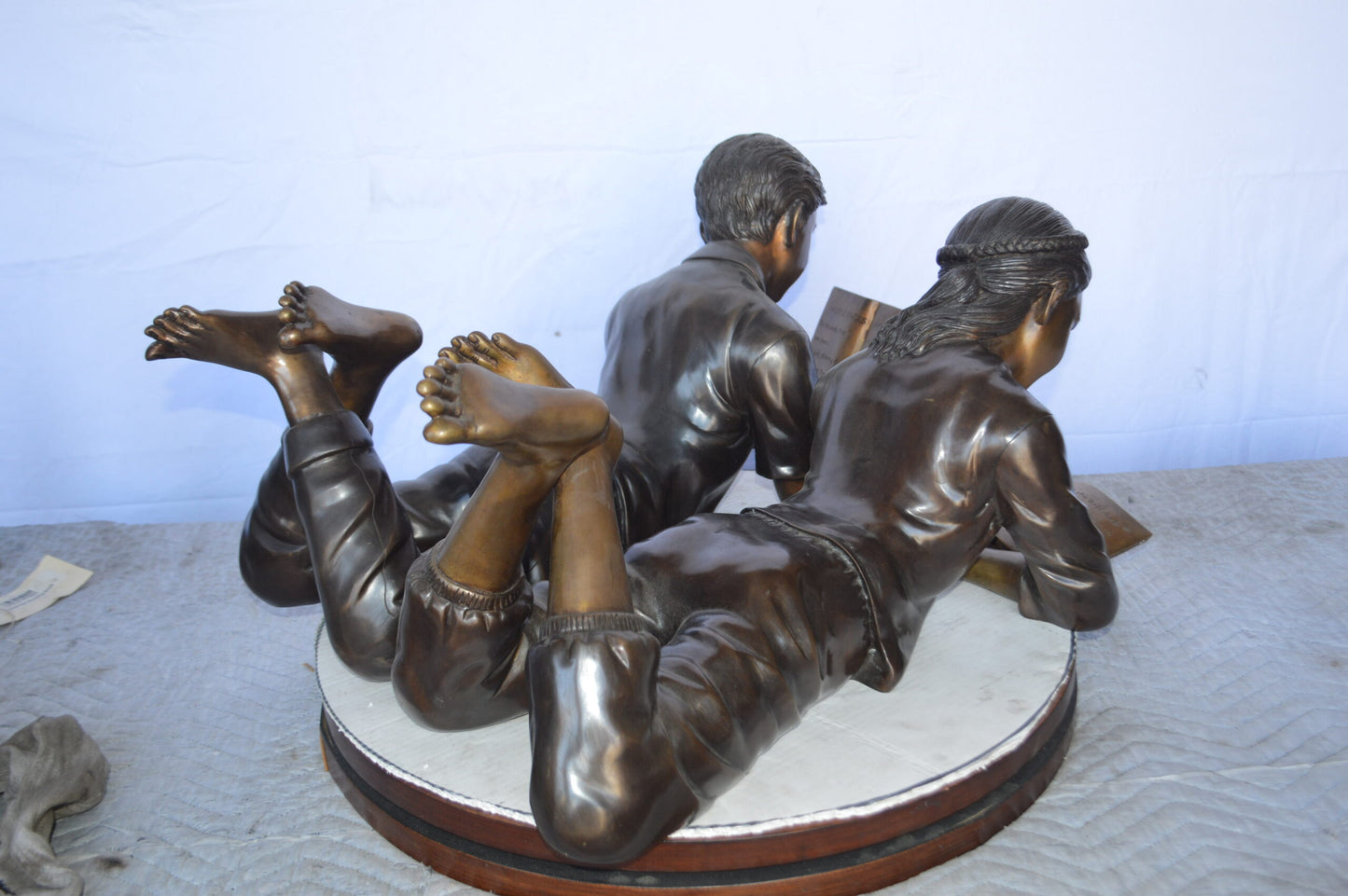 A Set of Boy and Girl Reading Books Bronze Statue - Size: 31"L x 10"W x 14"H.