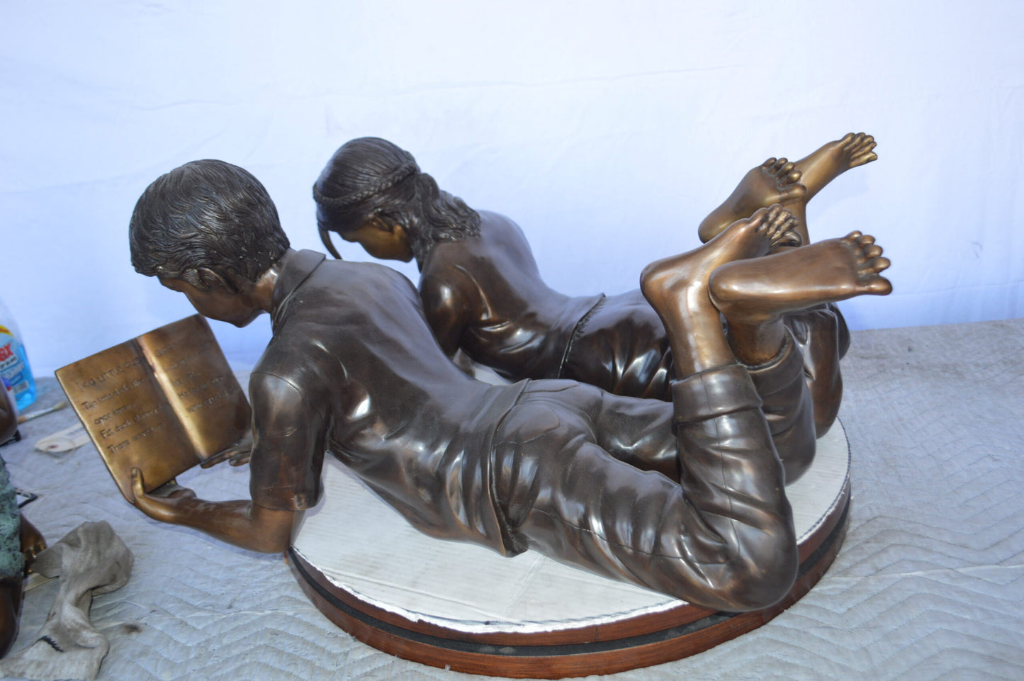 A Set of Boy and Girl Reading Books Bronze Statue - Size: 31"L x 10"W x 14"H.