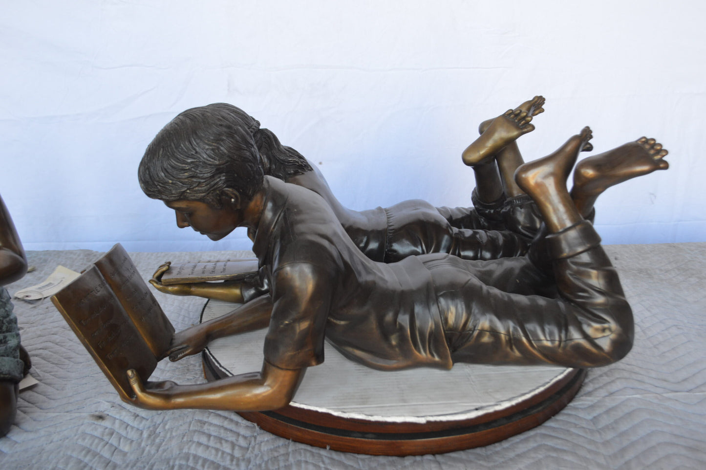A Set of Boy and Girl Reading Books Bronze Statue - Size: 31"L x 10"W x 14"H.