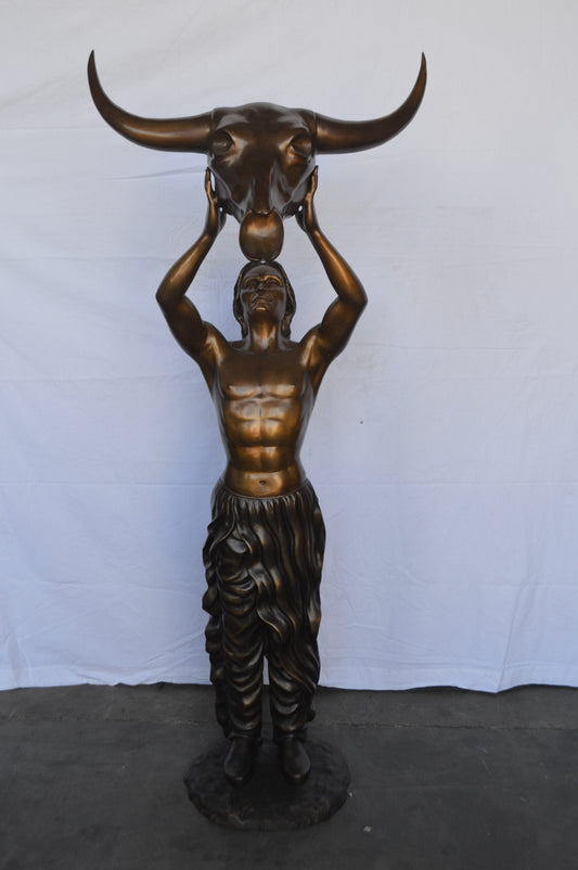 Indian Man Holds a Buffalo Skull Bronze Statue - Size: 29"L x 23"W x 72"H.