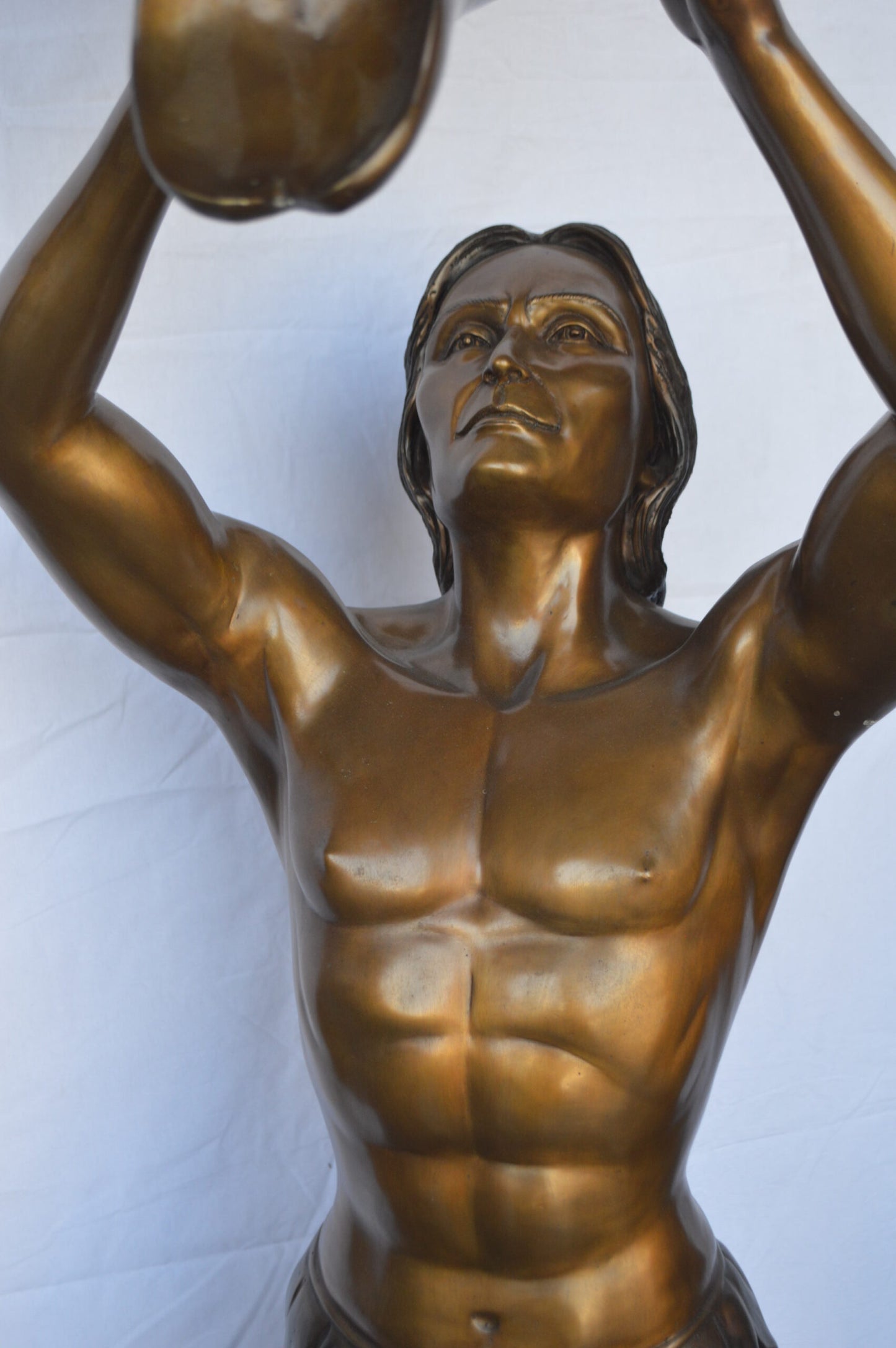 Indian Man Holds a Buffalo Skull Bronze Statue - Size: 29"L x 23"W x 72"H.