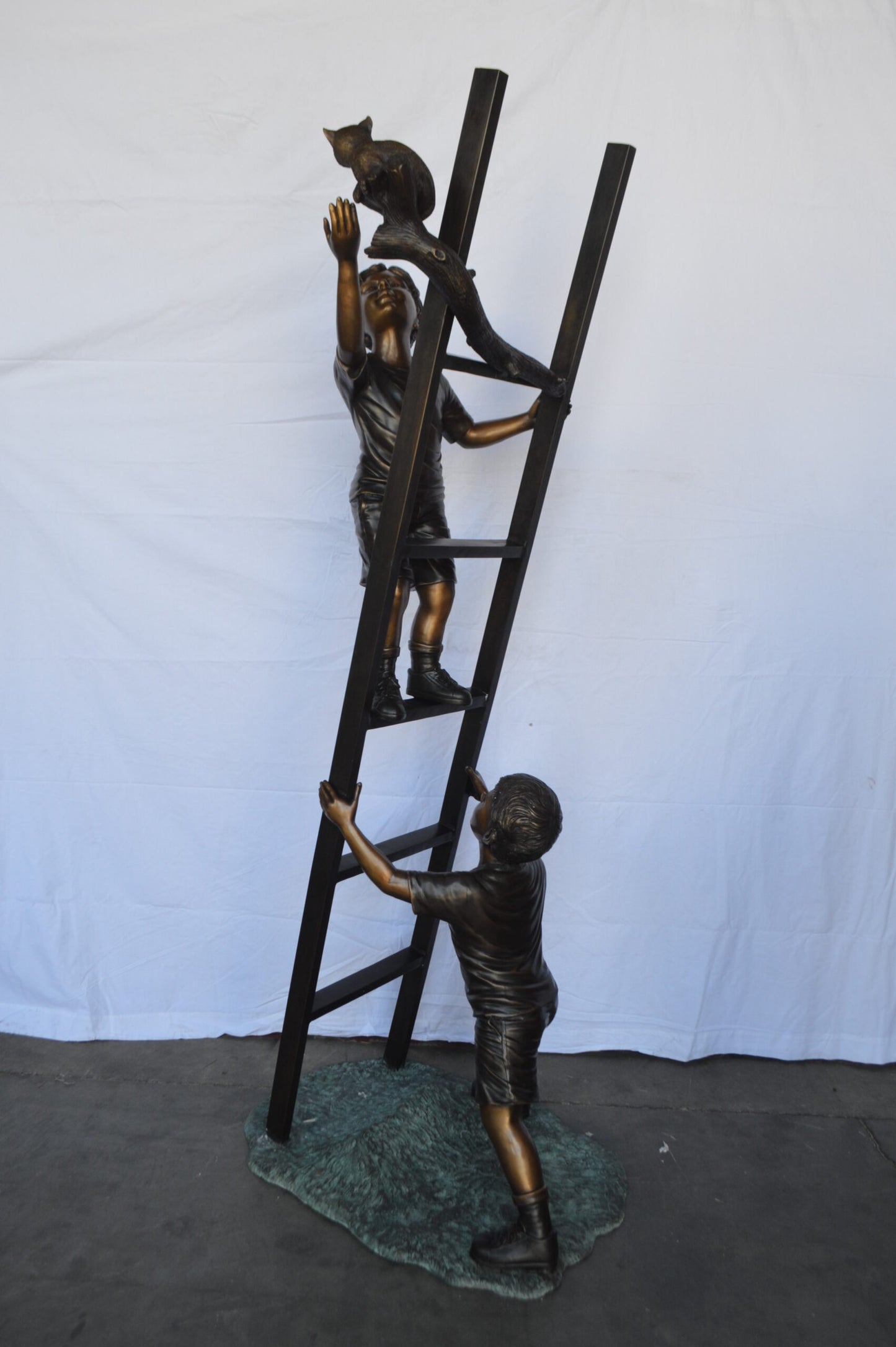 Two Kids Climb a Ladder Saving a Cat Bronze Statue - Size: 35"L x 24"W x 81"H.
