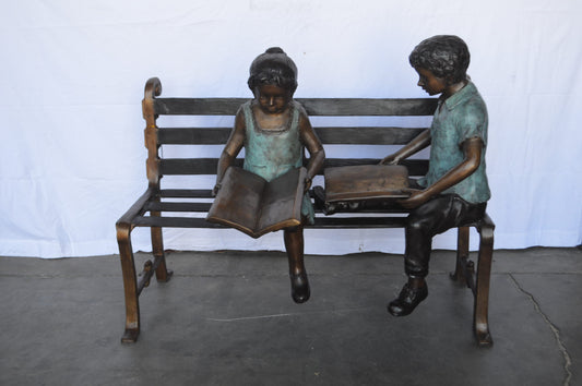 Boy And Girl Reading Books on Bench Bronze Statue - Size: 48"L x 29"W x 39"H.