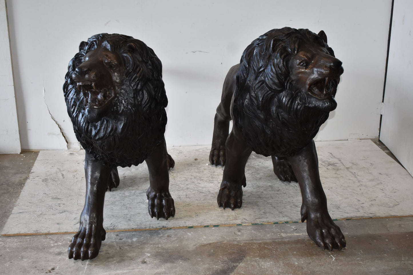 A Pair of Large Lions Walking Side by Side Bronze Statues Size: 24" x 60" x 41"H