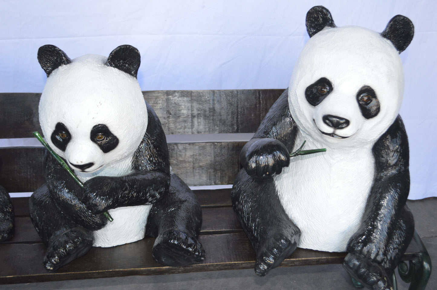 Three Panda Bears Sitting on Bench Bronze Statue - Size: 53"L x 28"W x 36"H.