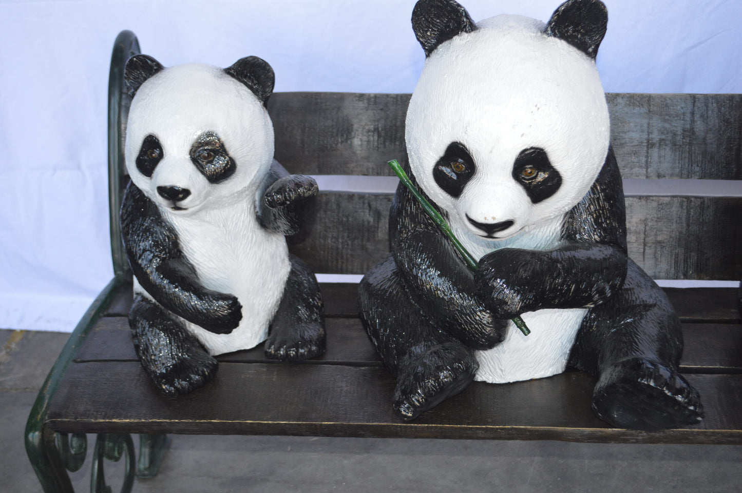 Three Panda Bears Sitting on Bench Bronze Statue - Size: 53"L x 28"W x 36"H.