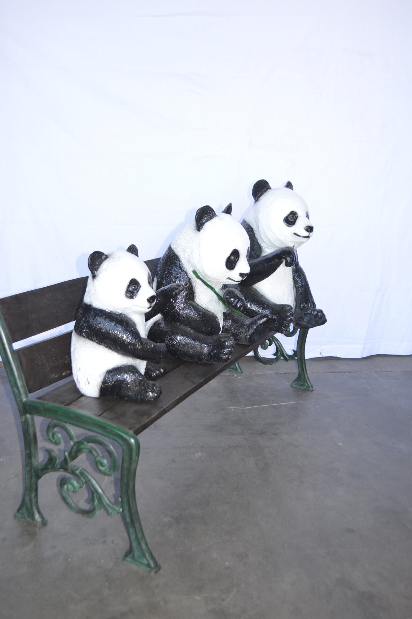 Three Panda Bears Sitting on Bench Bronze Statue - Size: 53"L x 28"W x 36"H.